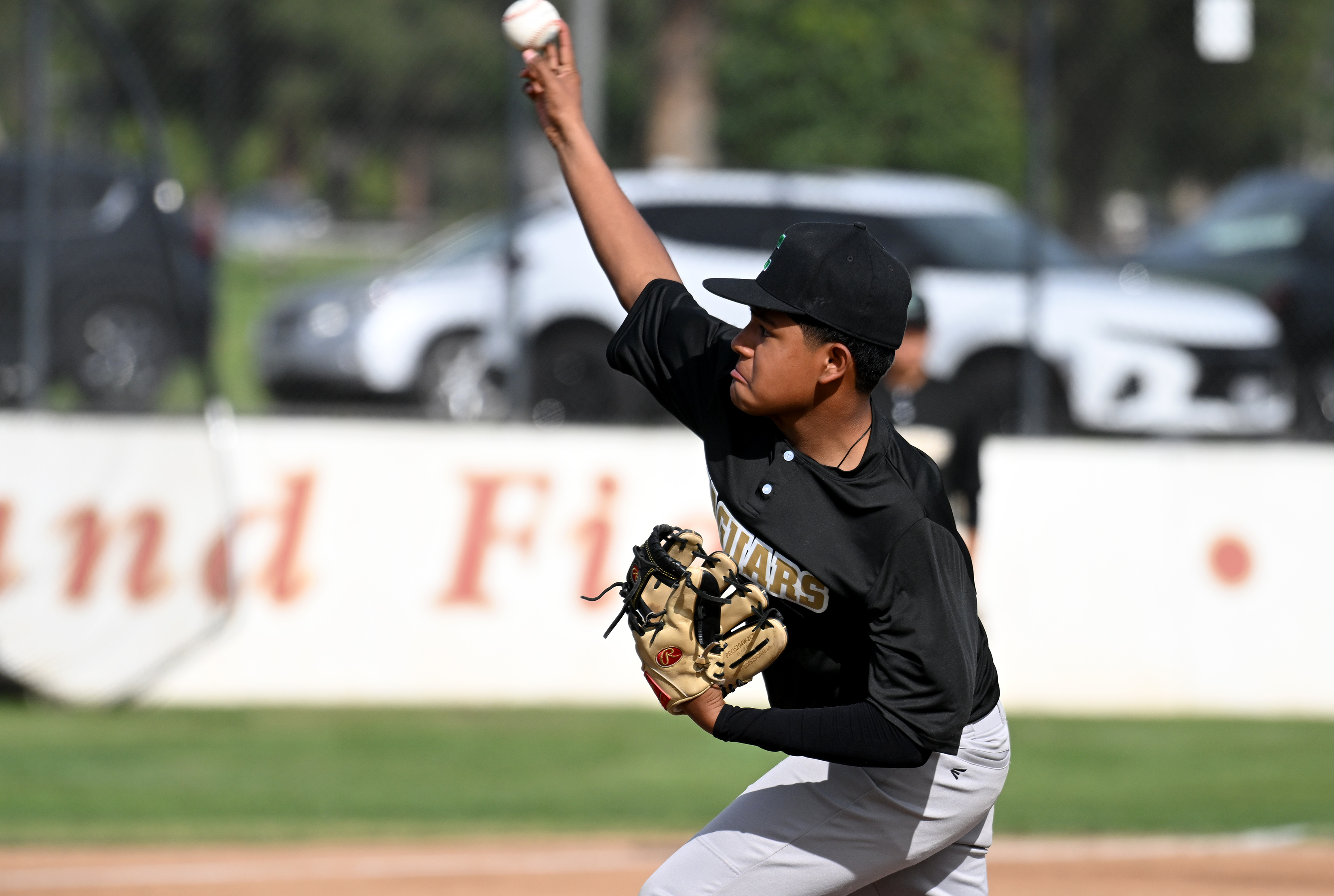 Fabian Vigil pitches for Cabrillo against Wilson during opening day...