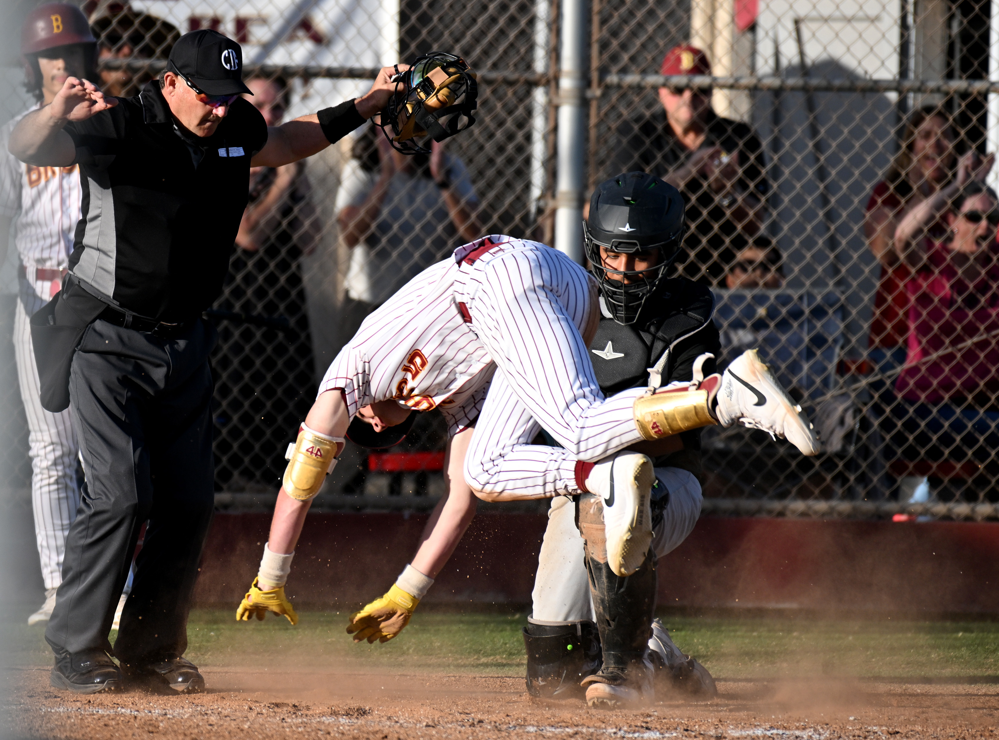 Wilsonâs Eddy Becker scores a run in the bottom of...