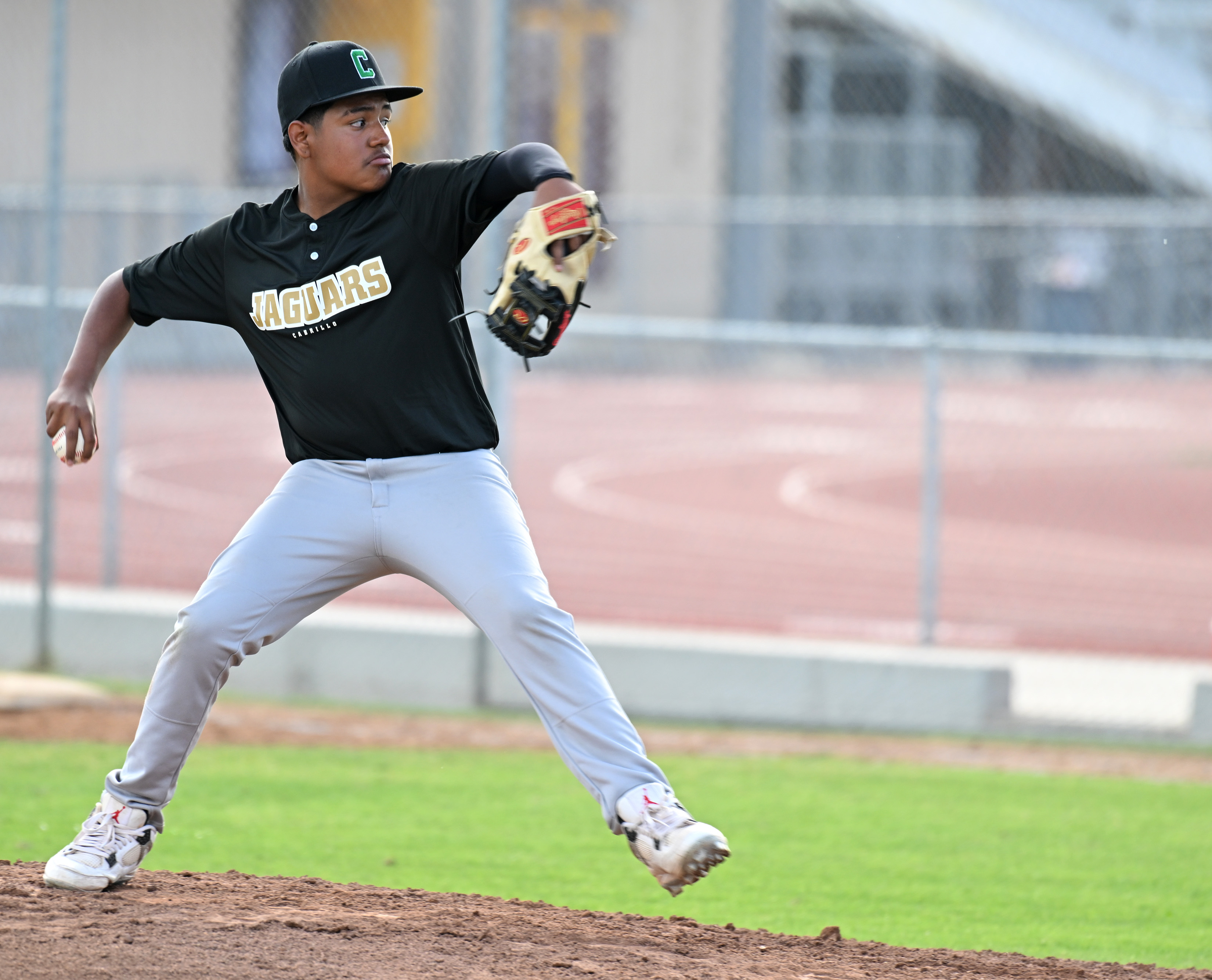 Fabian Vigil pitches for Cabrillo against Wilson during opening day...