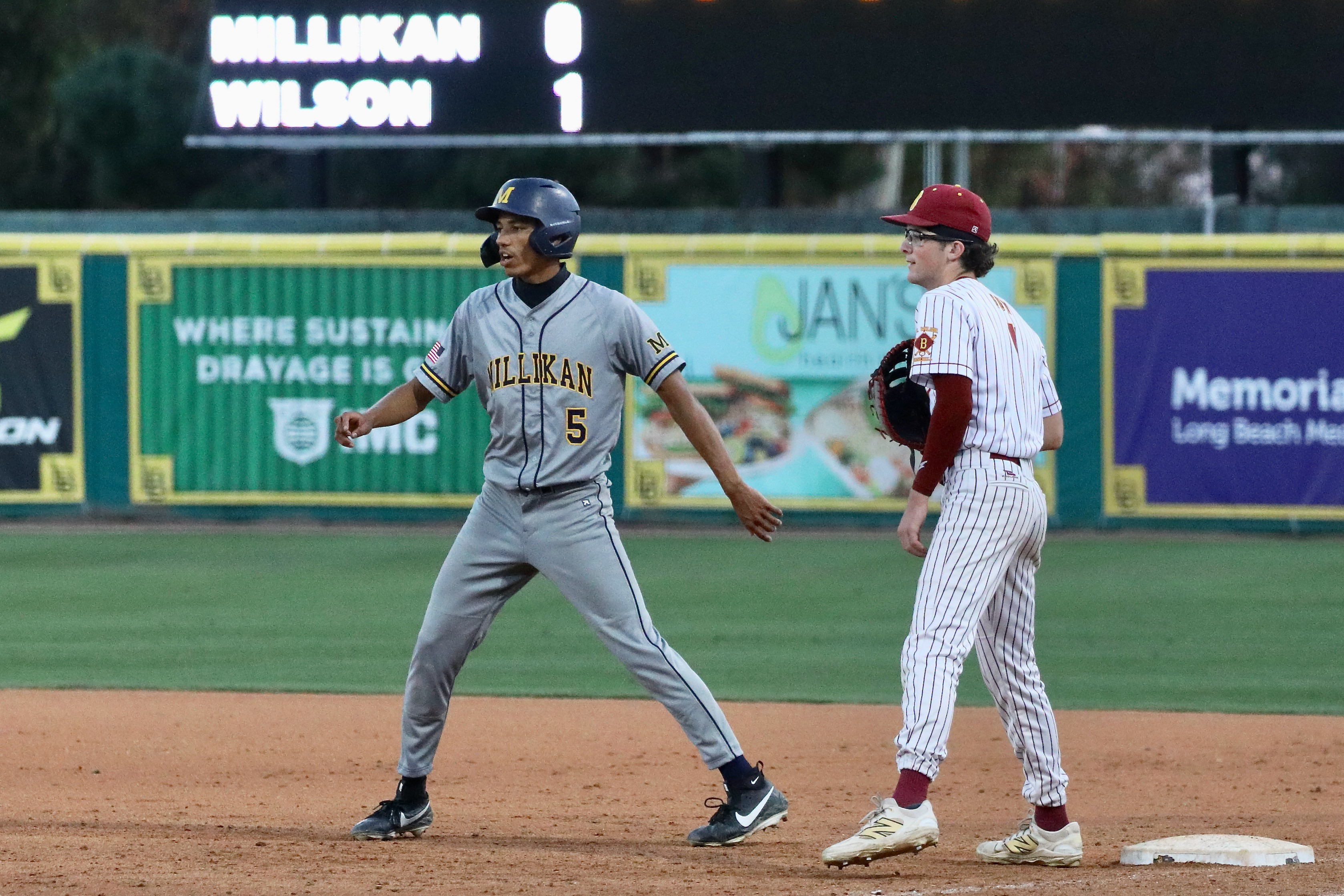 Wilson first basemen Shane Guy keeps an eye on Millikanâs...