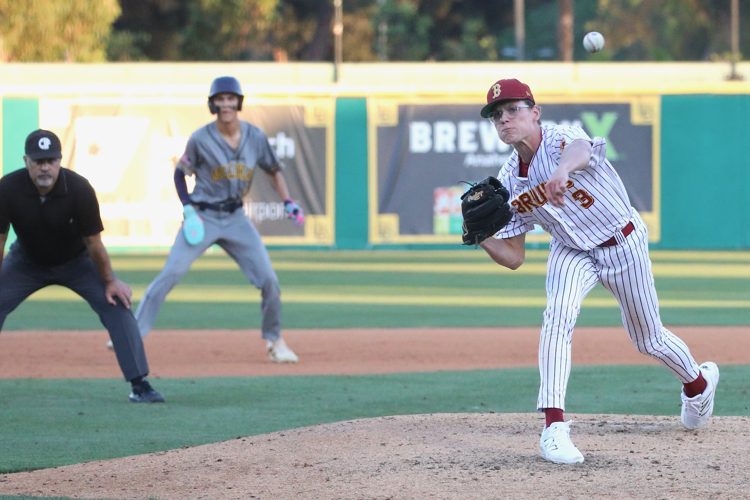 Wilson starter George Cooper delivers a pitch with a Millikan...