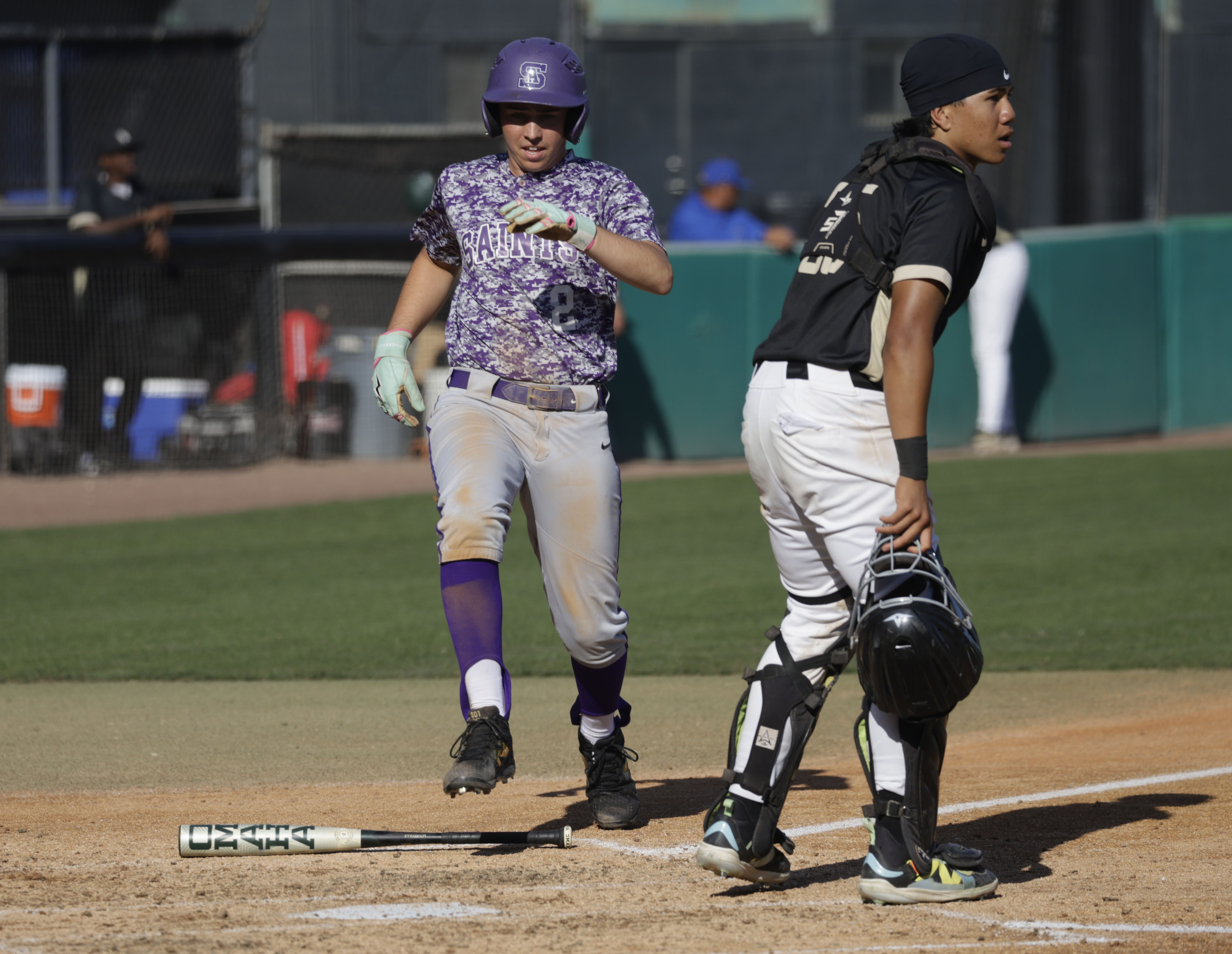 St. Anthony’s Nick Galluccio (2) scores for the Saints behind...