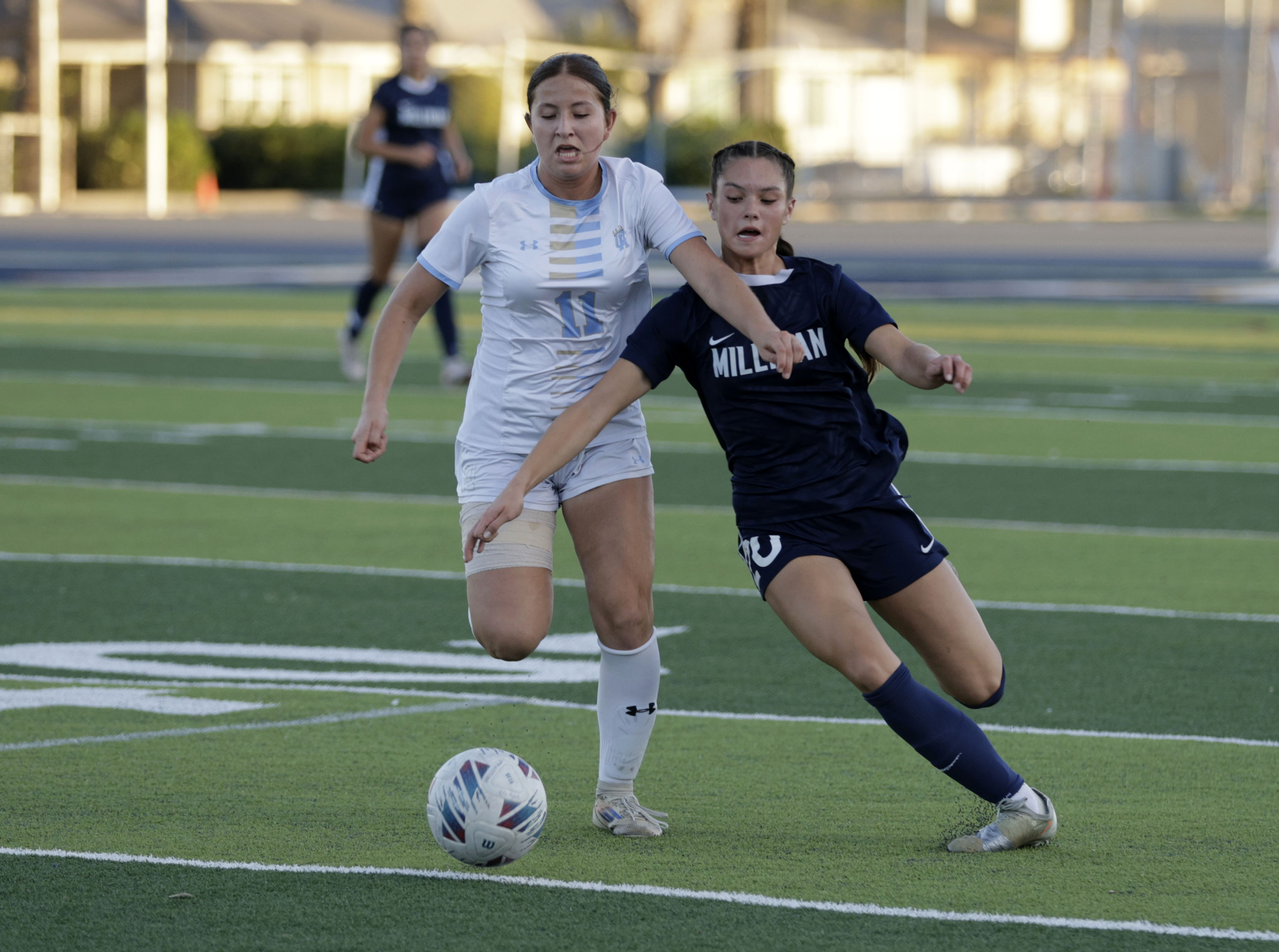 Quartz Hills Renata Videz (11) and Millikans Ellie Carungcong (20)...
