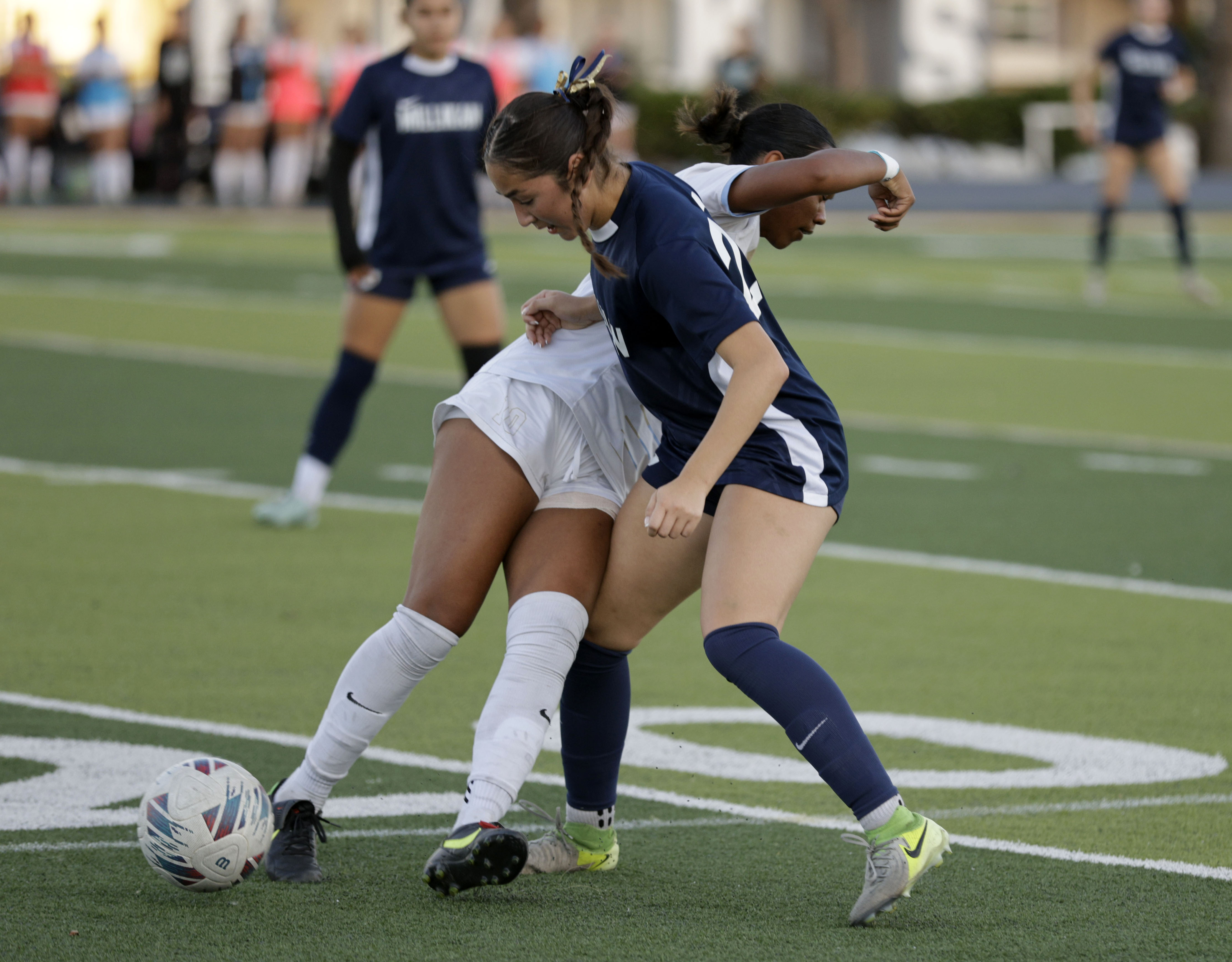 Millikans Jayla Cortes (23) looks to get the ball around...