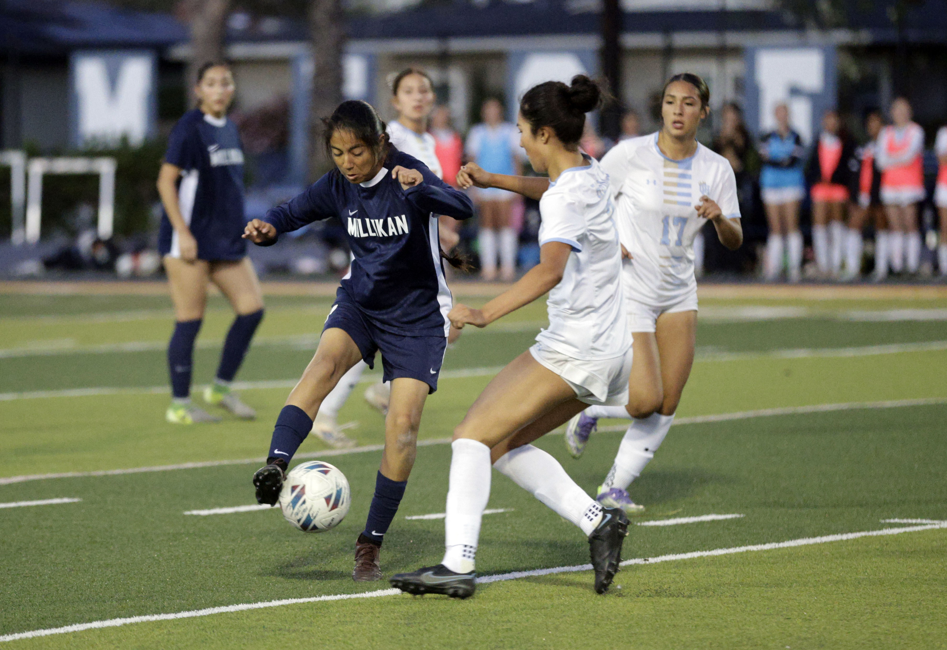 Millikans Alexandra Rios (7) looks to get the ball past...