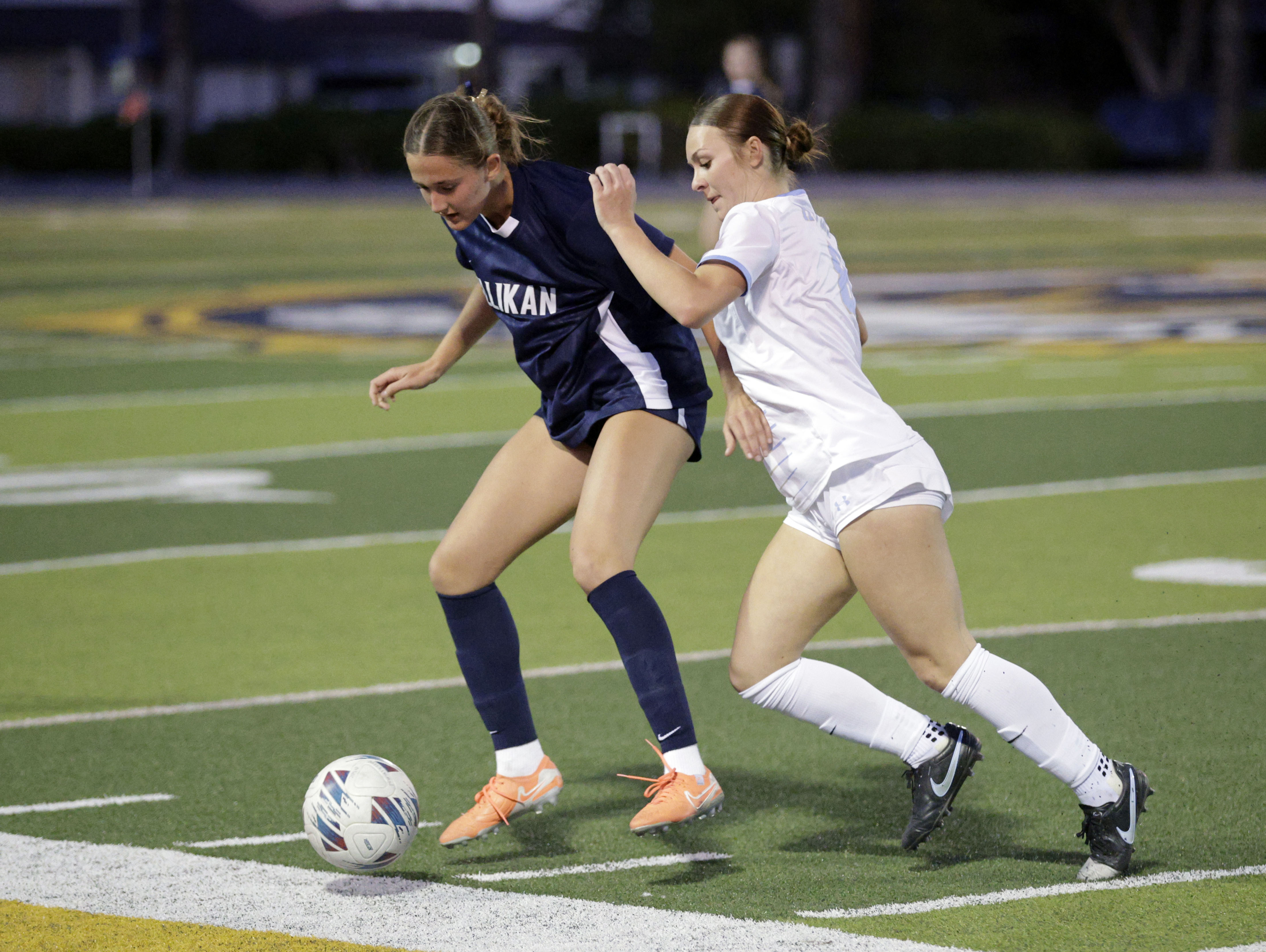 Millikans Sarah Thaut (17) tries to fend off Quartz Hills...