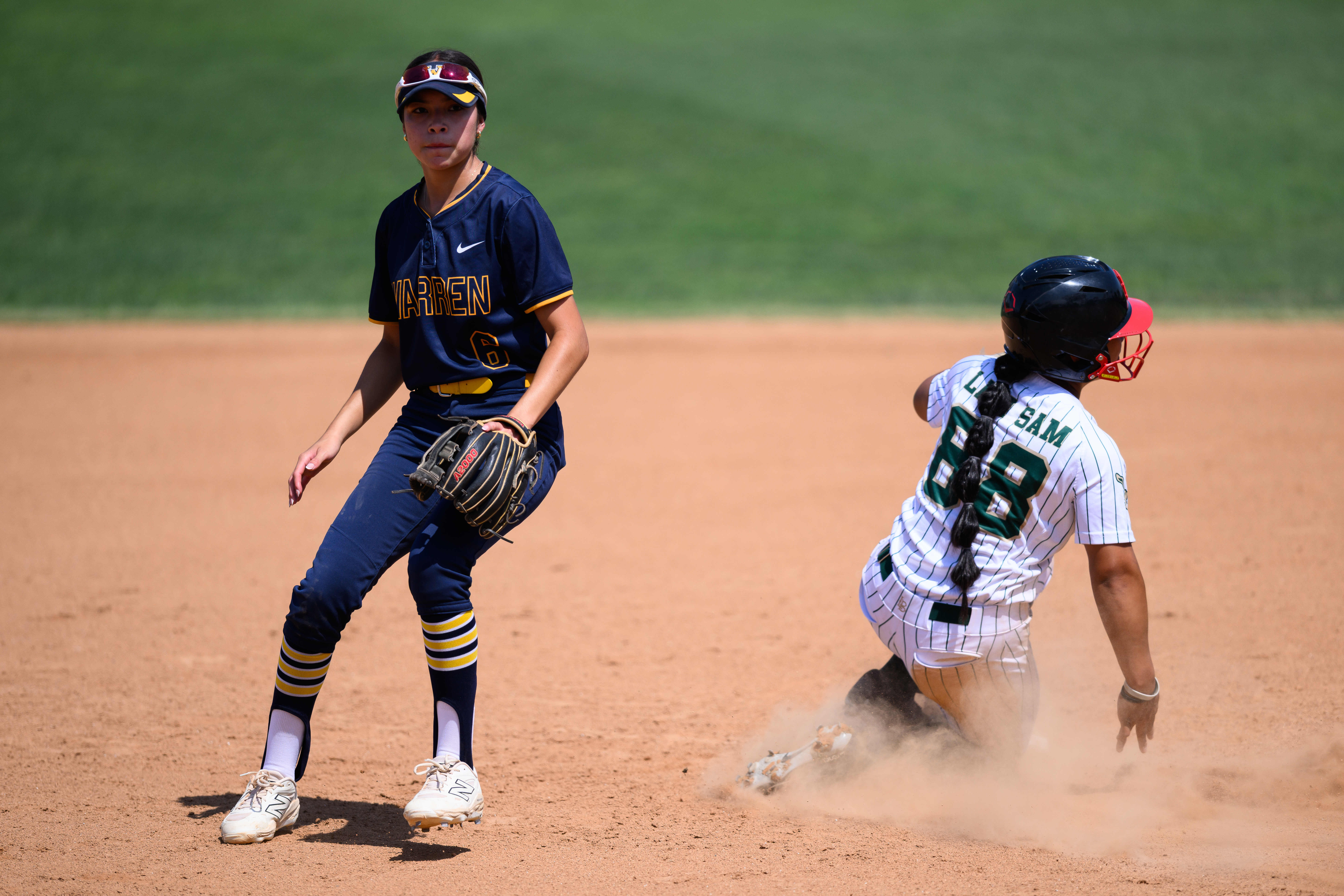 Warren High School’s Lisa Garcia (6) looks for the ball...