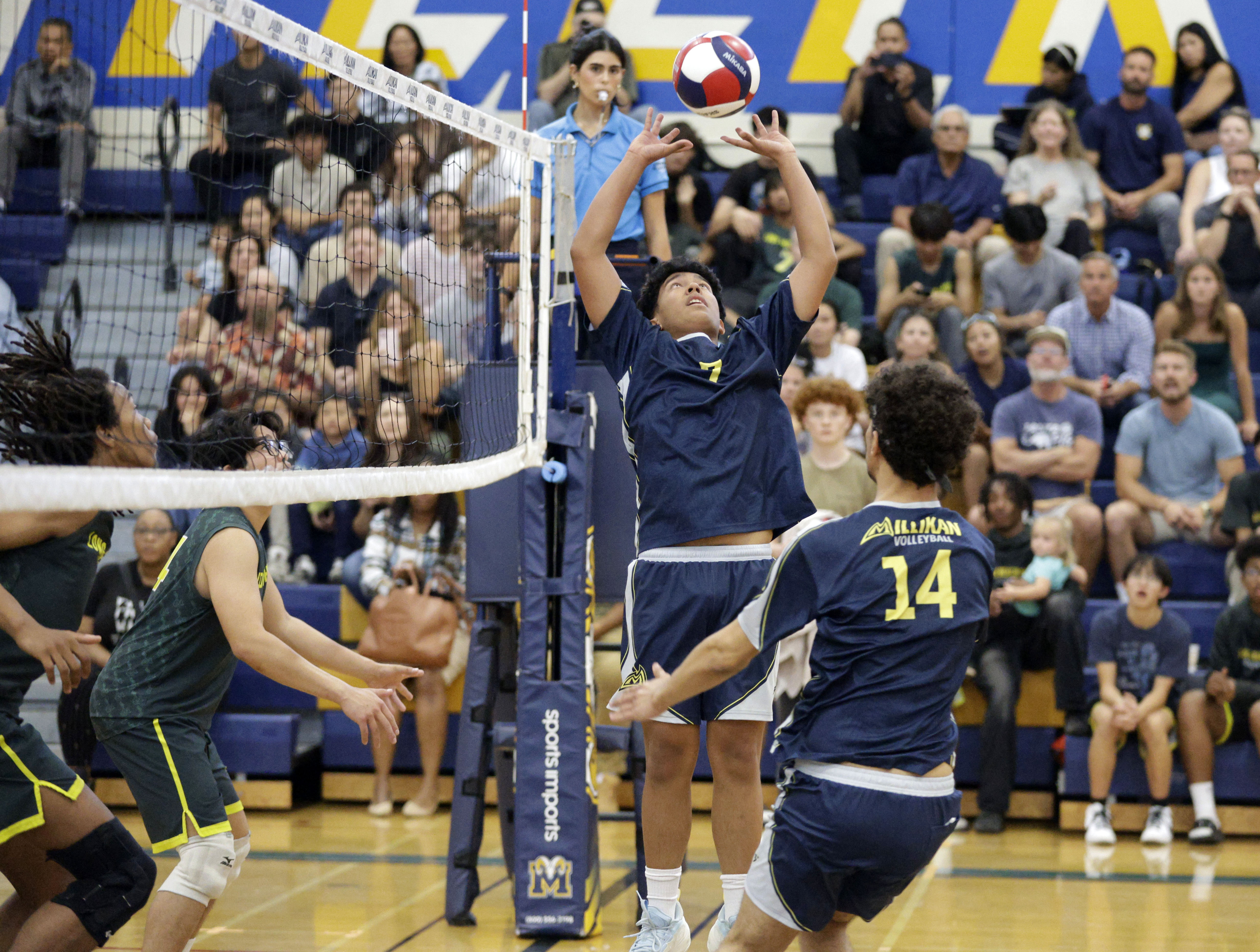 Millikan’s Noble Pagulayan (7) sets the ball as the Rams...