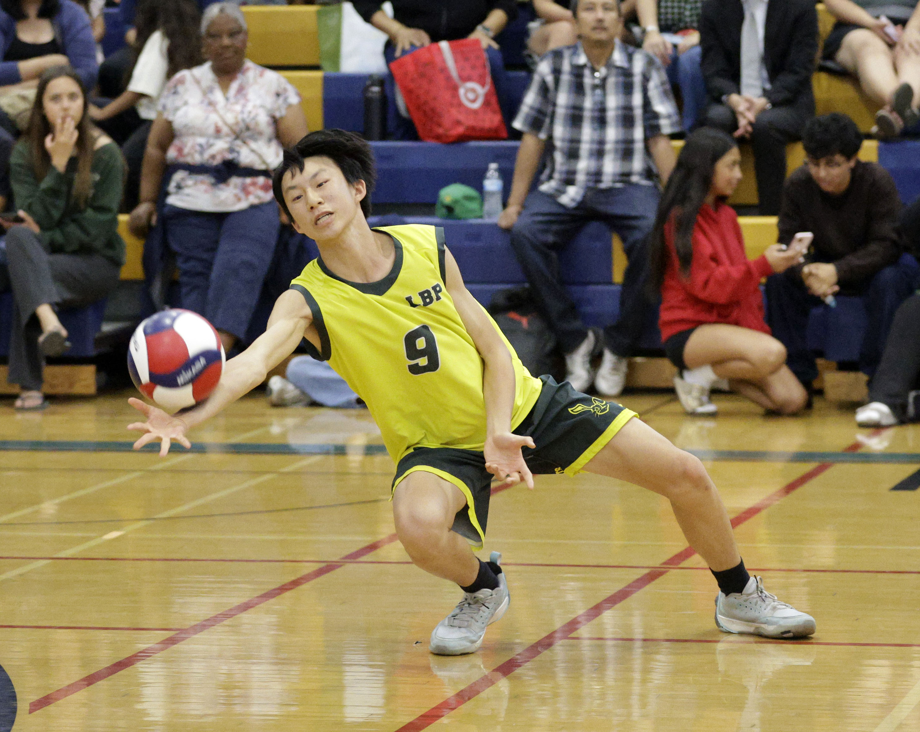 Long Beach Poly’s Paul Taso (9) reaches for the ball...