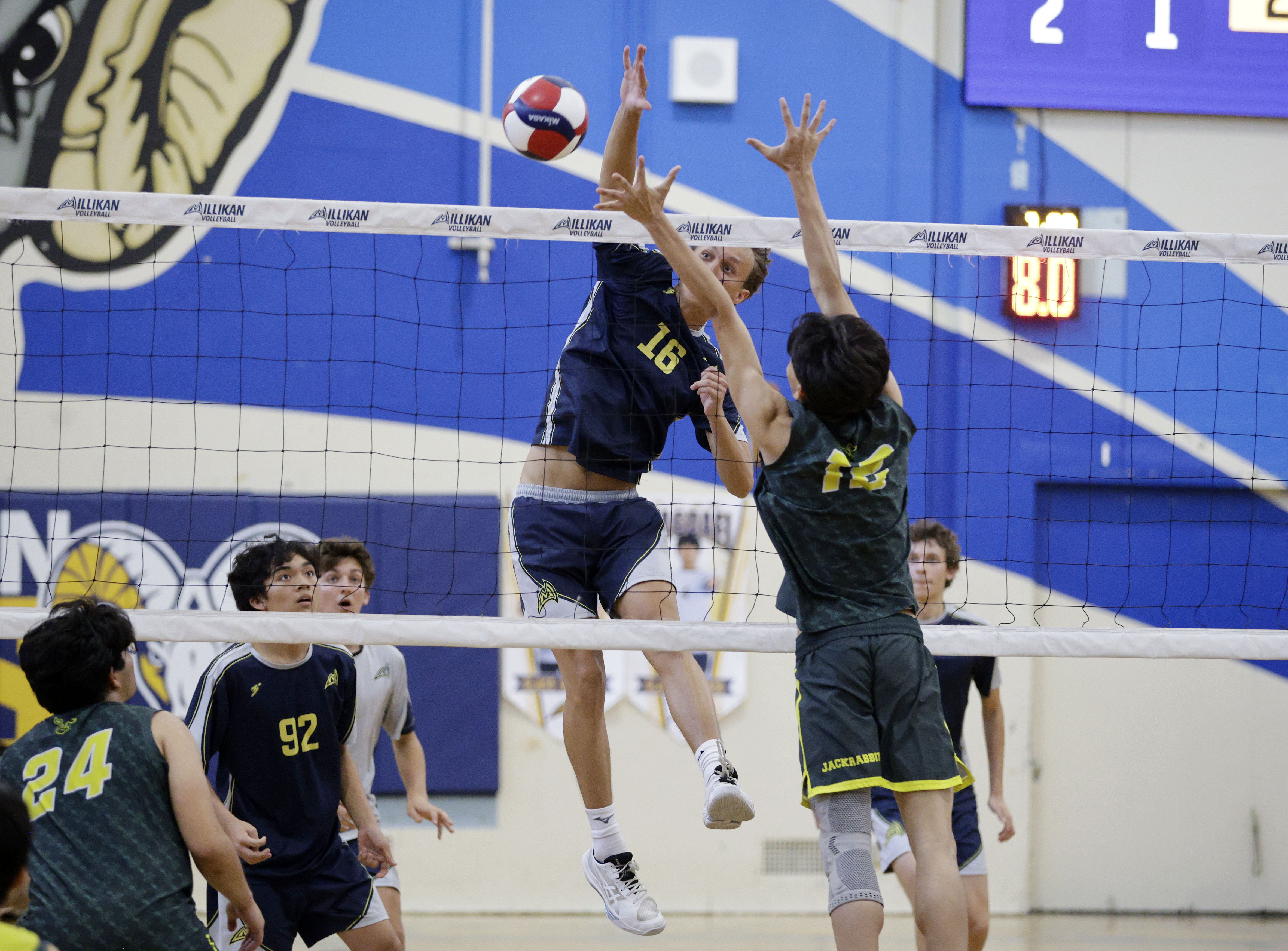 Millikan’s Evan Crucil Chambers (16) hits the ball around Long...