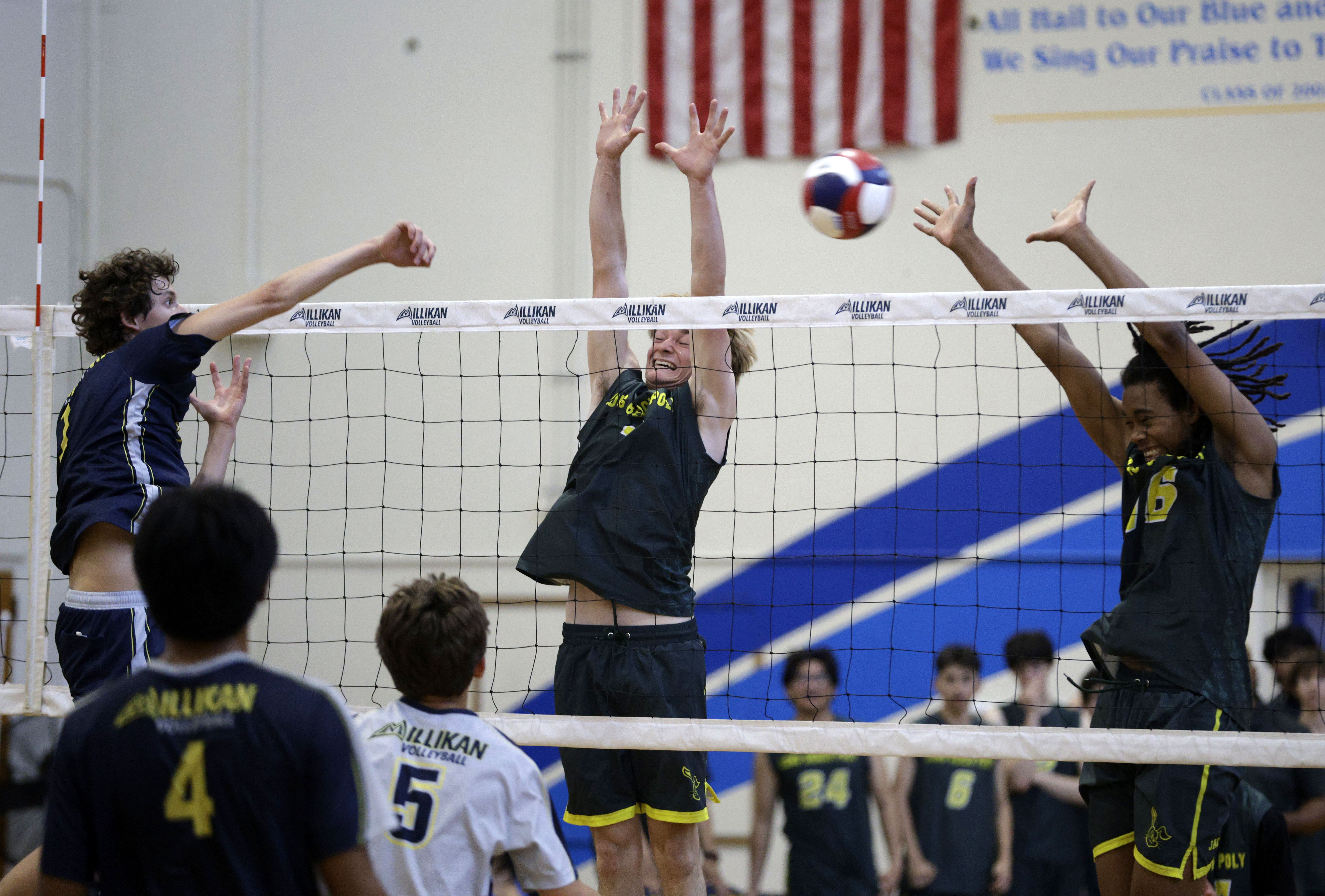 Millikan’s Jacob Karkanen (1) hits the ball past Long Beach...