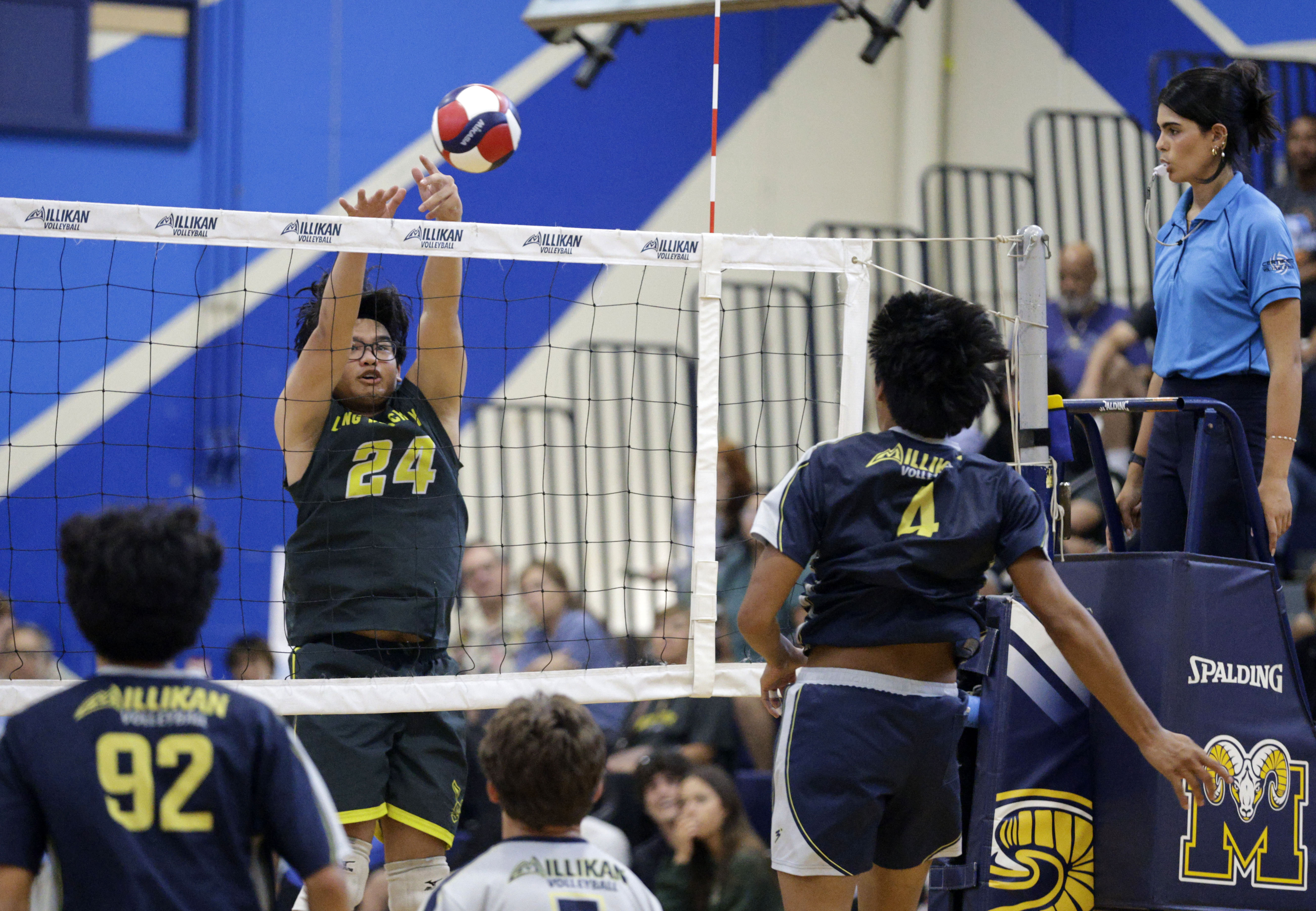 Long Beach Poly’s Dylan Bucu (24) goes up for the...