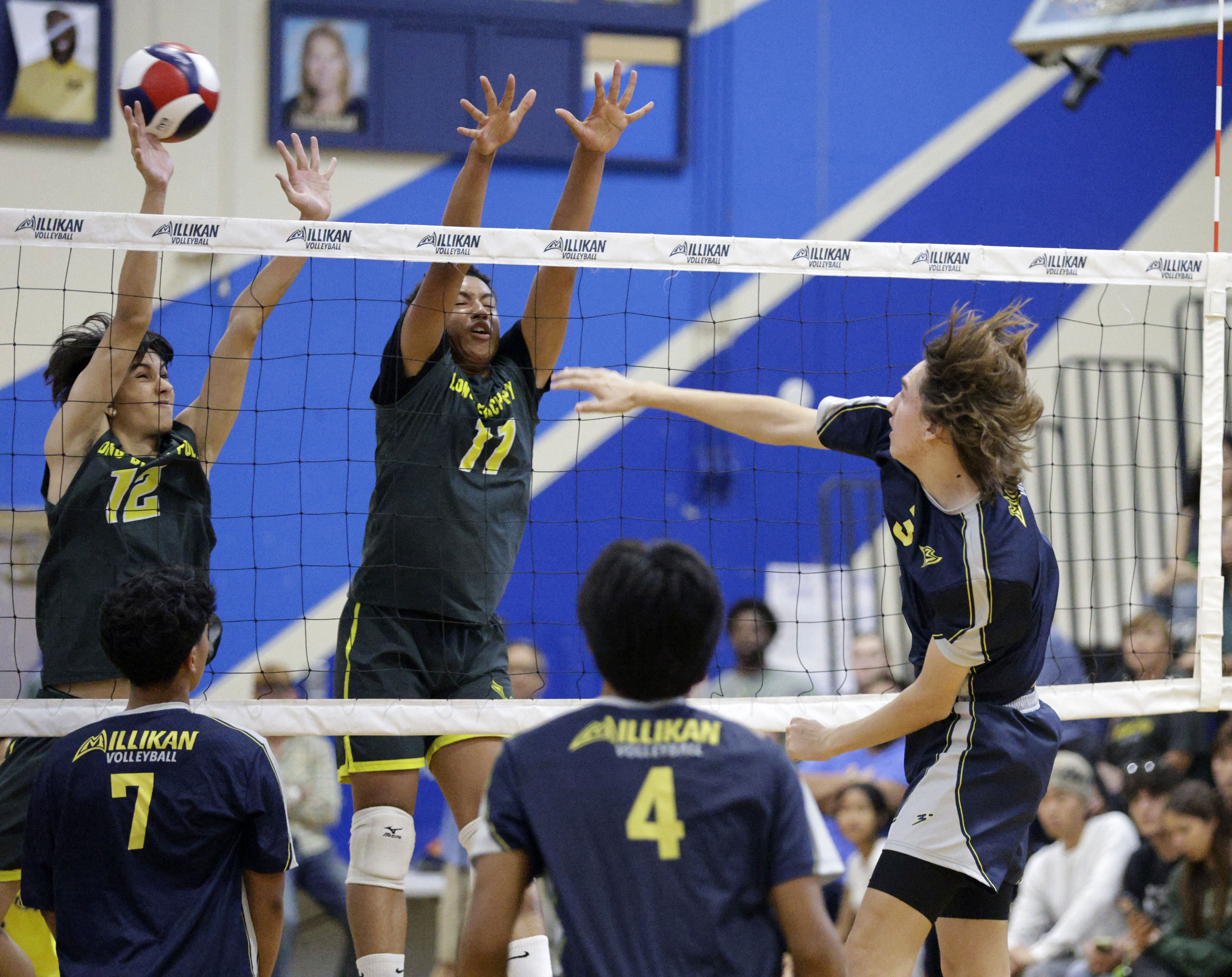 Millikans Wes Aguilar (3) hits the ball past Long Beach...