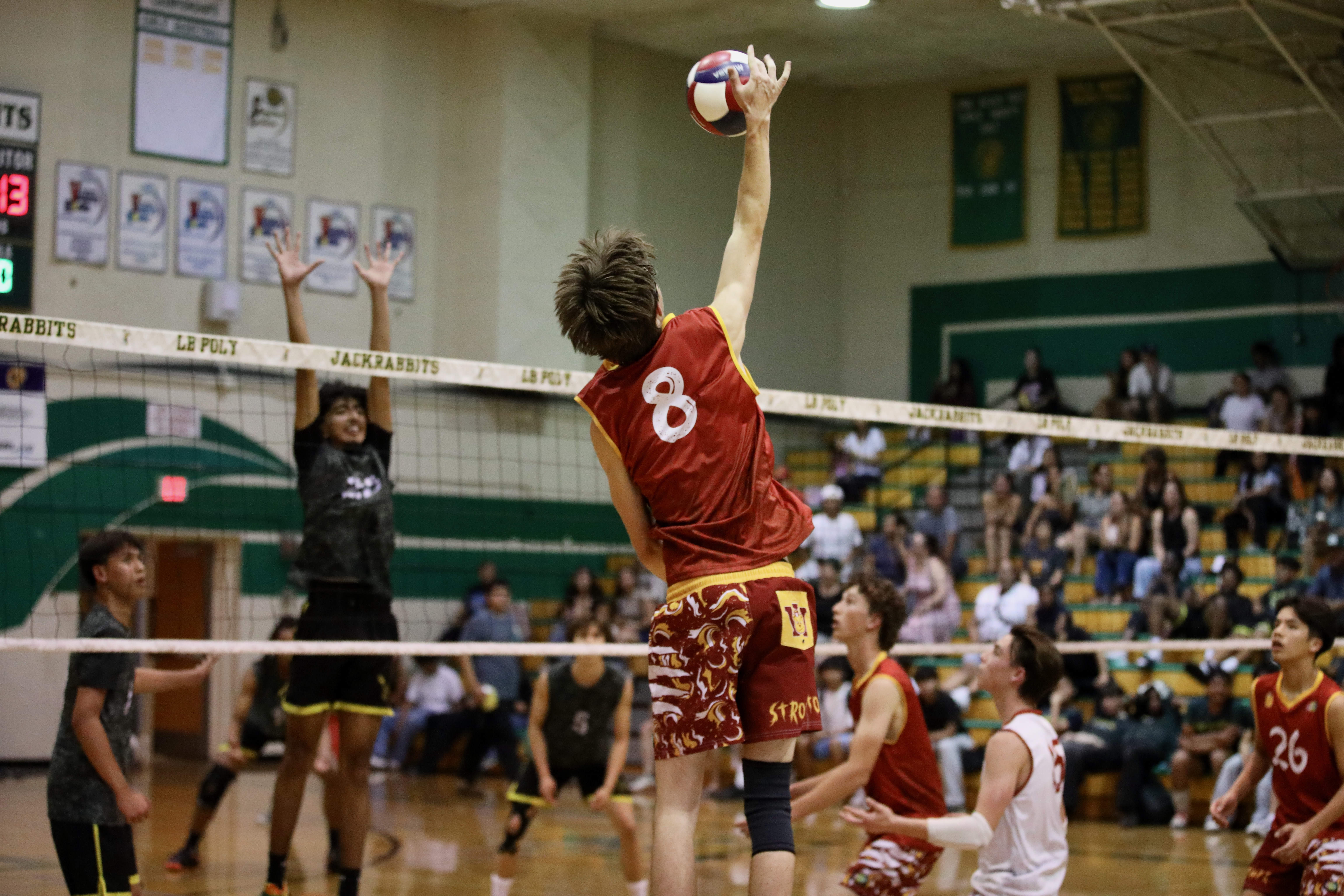 Wilsonâs Tobin Hackney goes up for a kill in action...