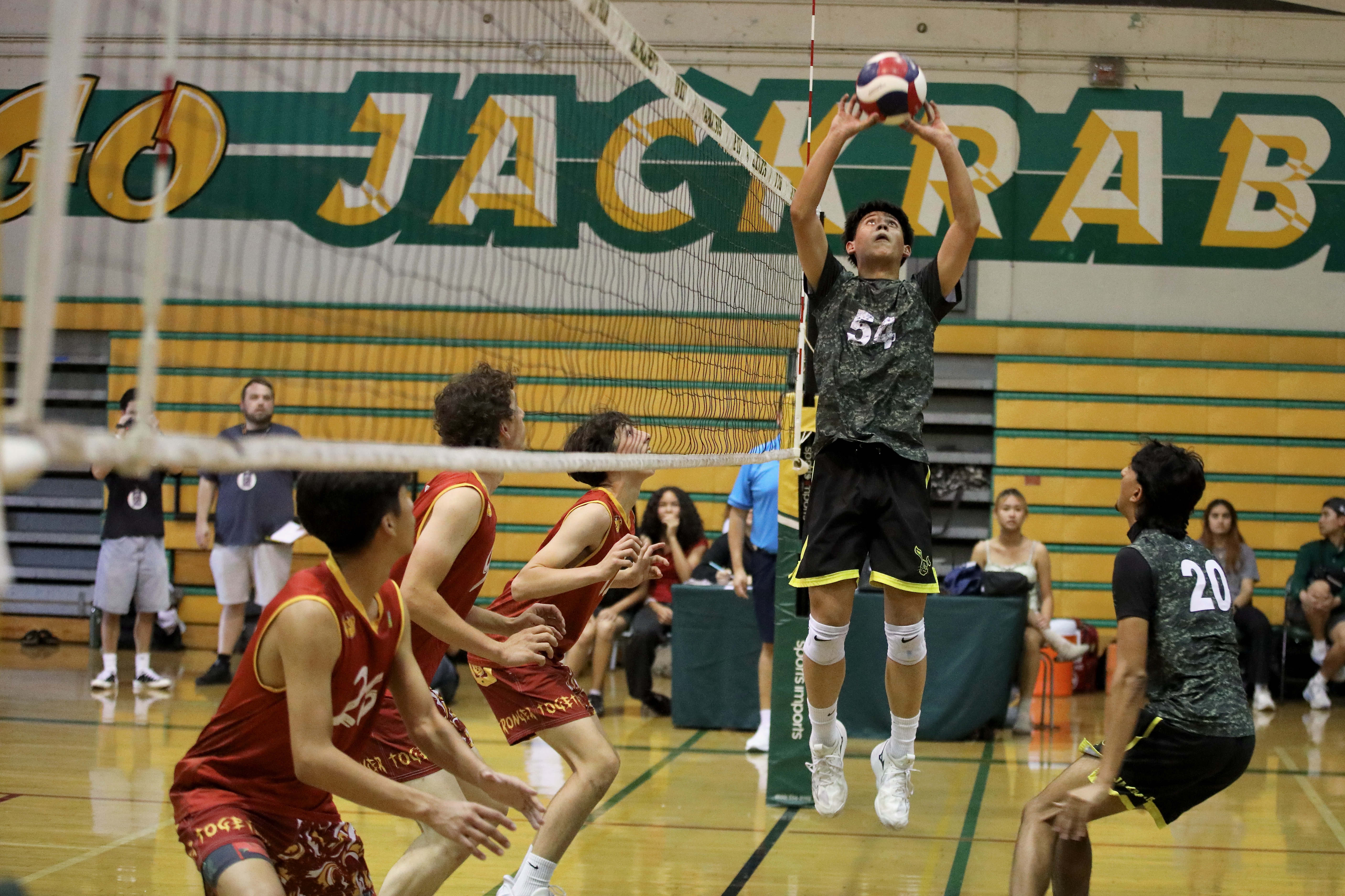 Long Beach Polyâs Josiah Walton sets the ball in action...