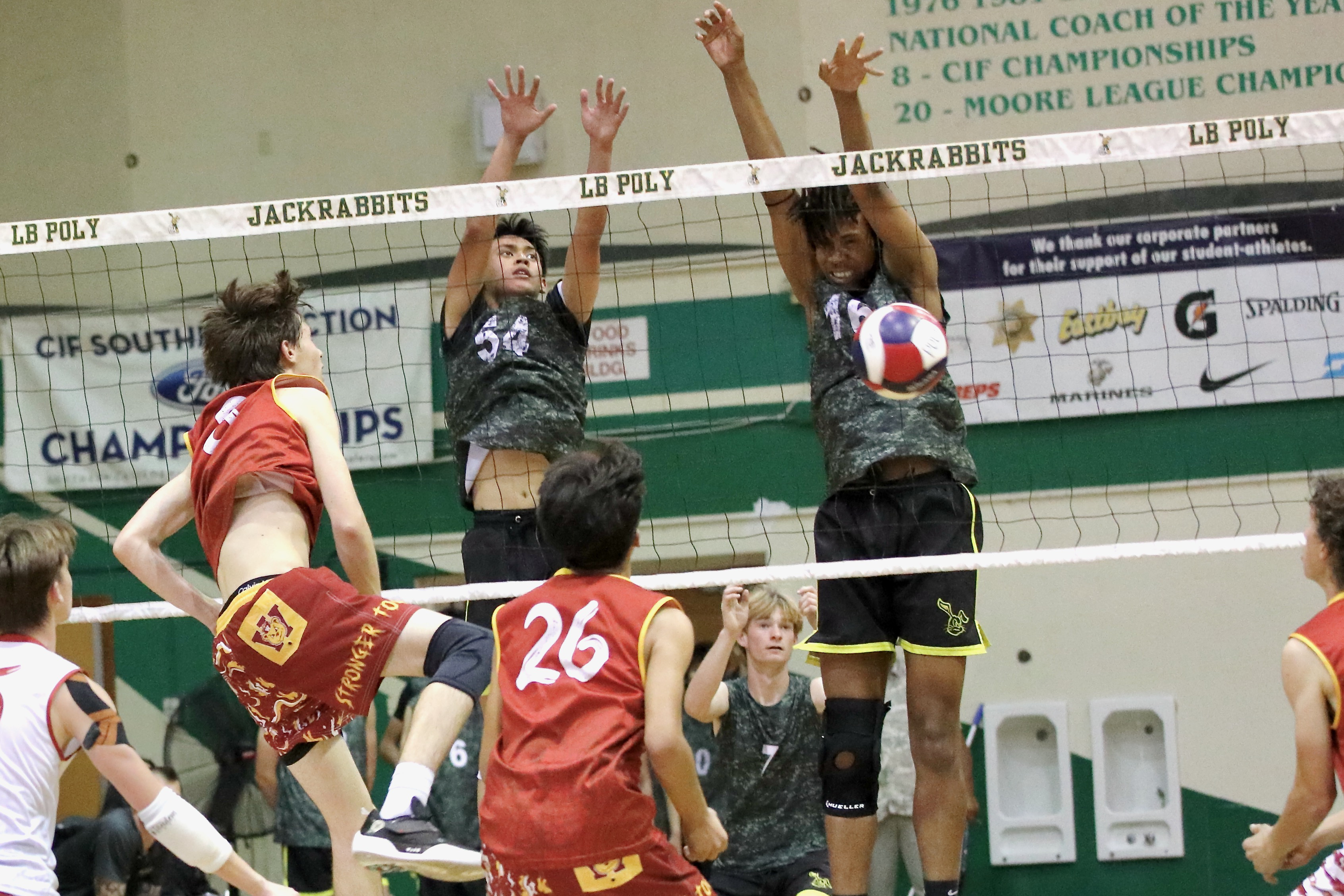 Long Beach Polyâs Josiah Walton, left, and Josiah Hill defend...