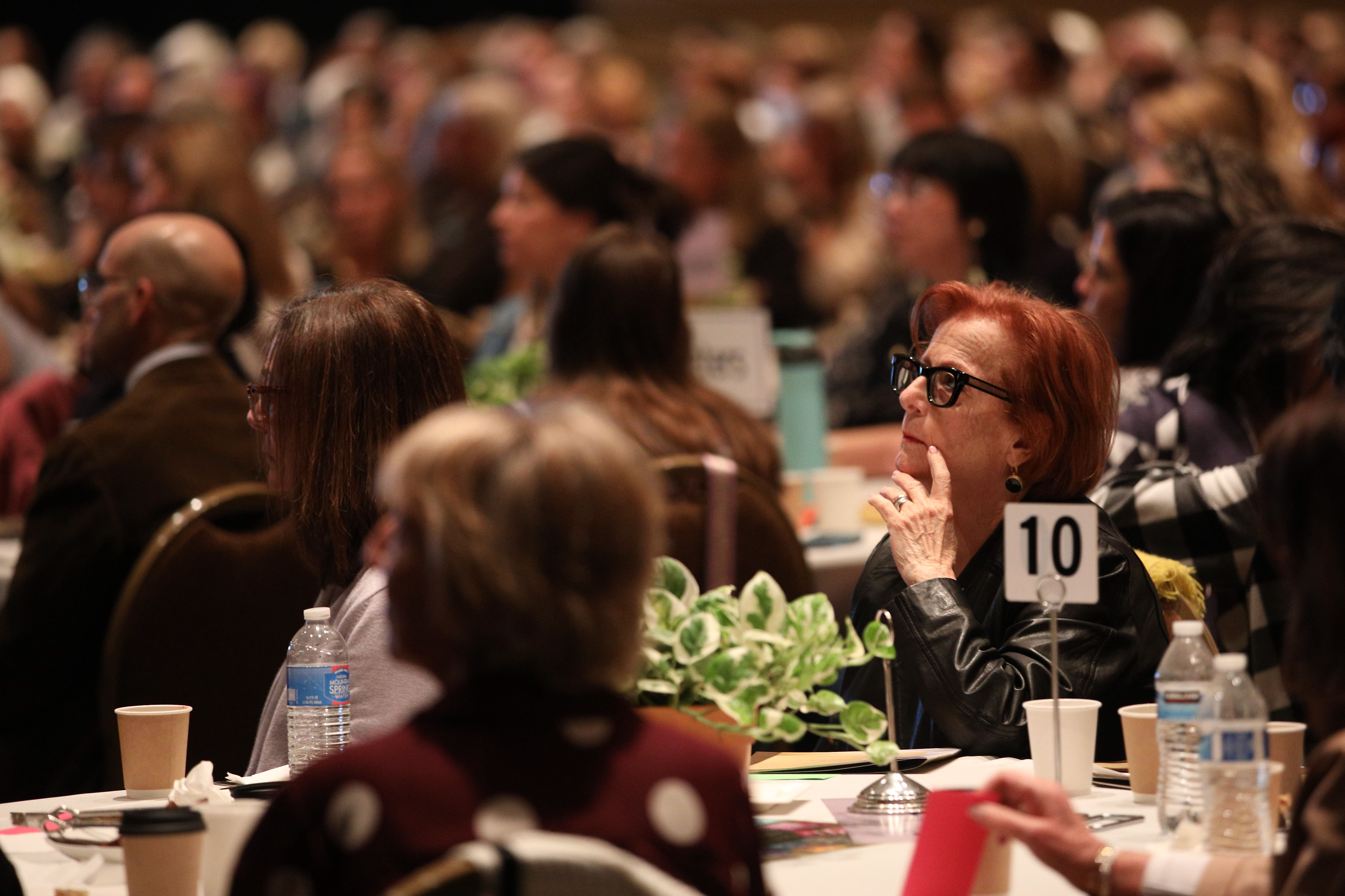 Attendees fill the ballroom for the sold-out Literary Women Festival...