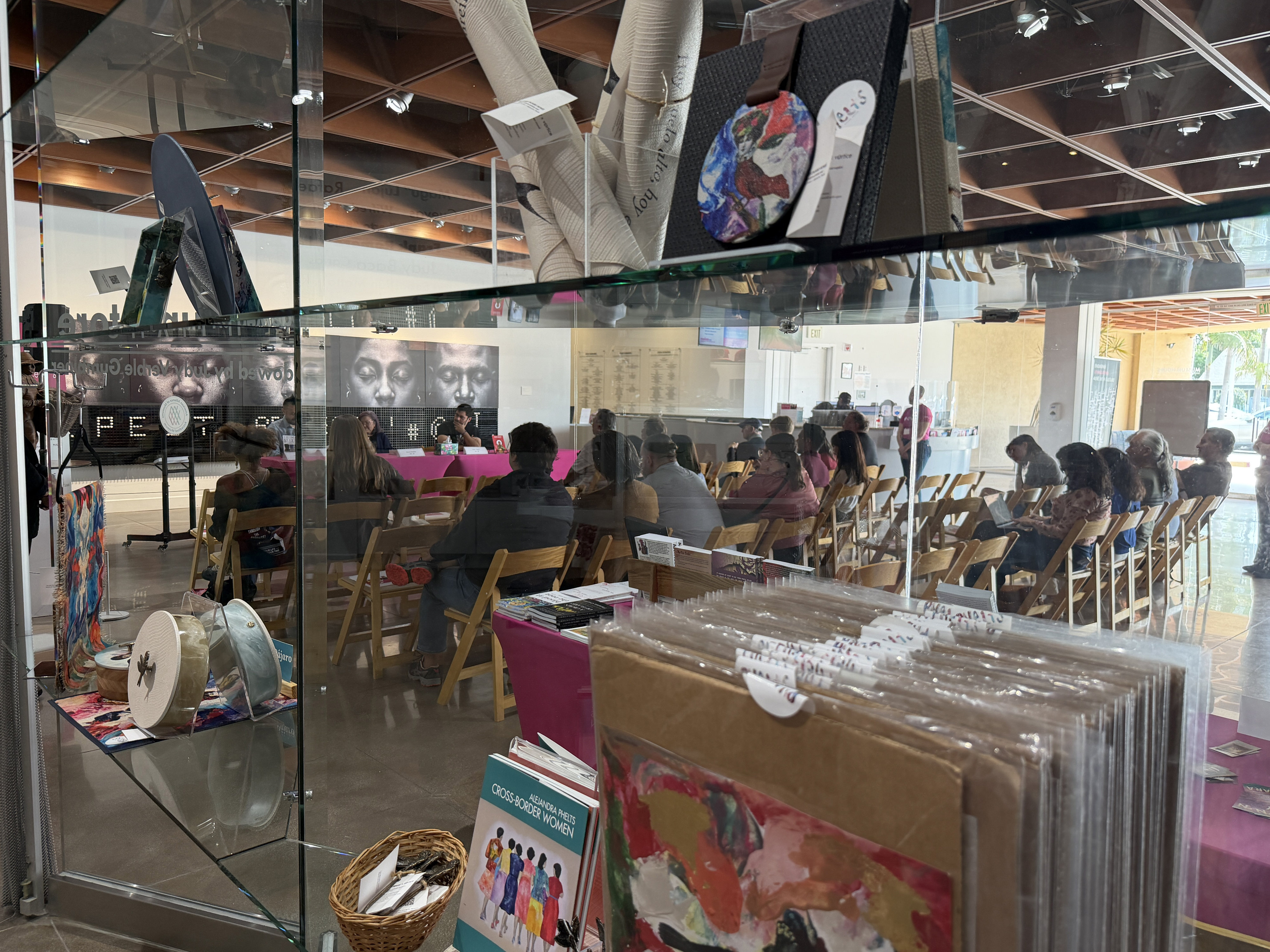 Looking at the audience through the gift shop windows at...