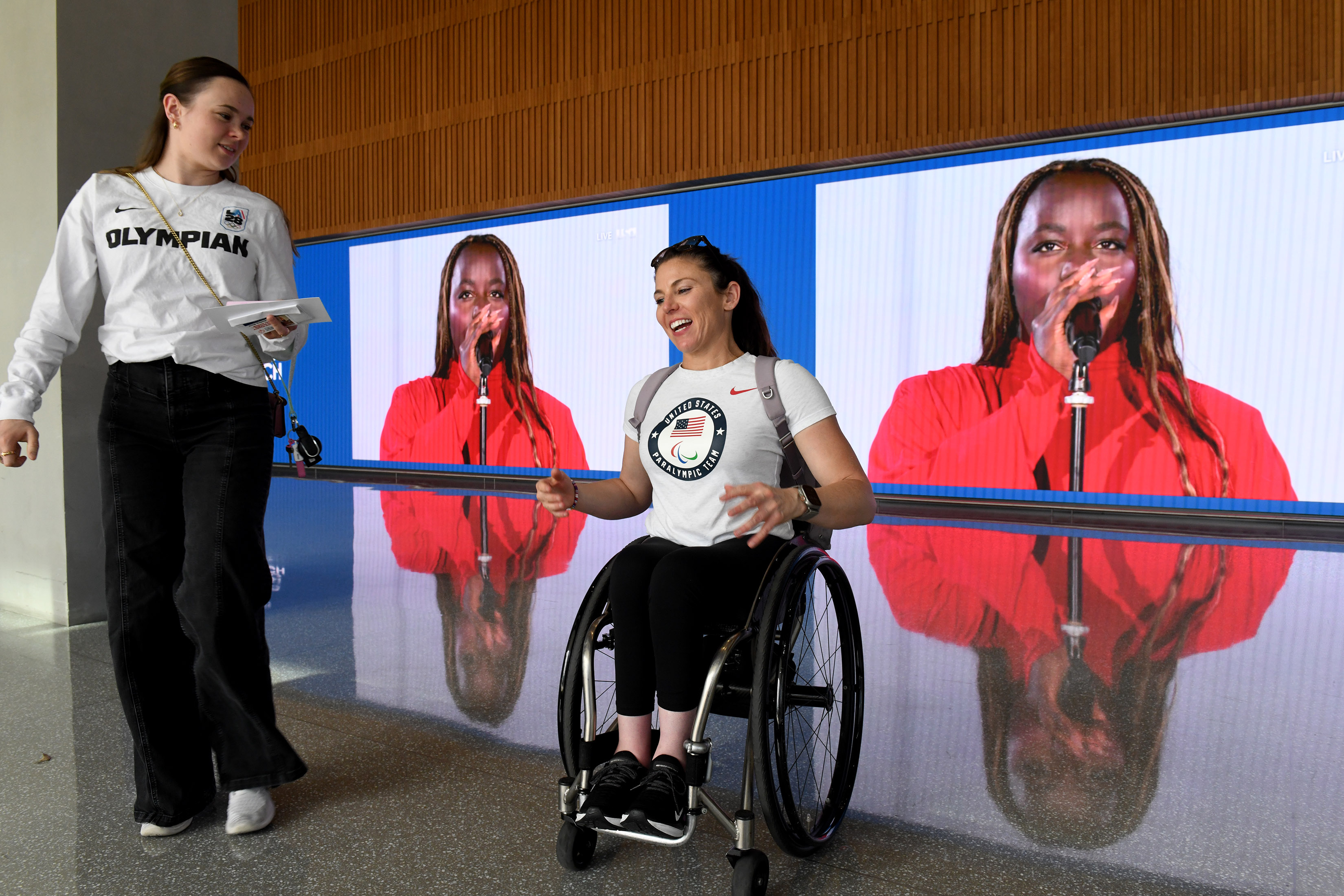 Olympians Mariah Bell, left, and Amanda McGrory attend a community...