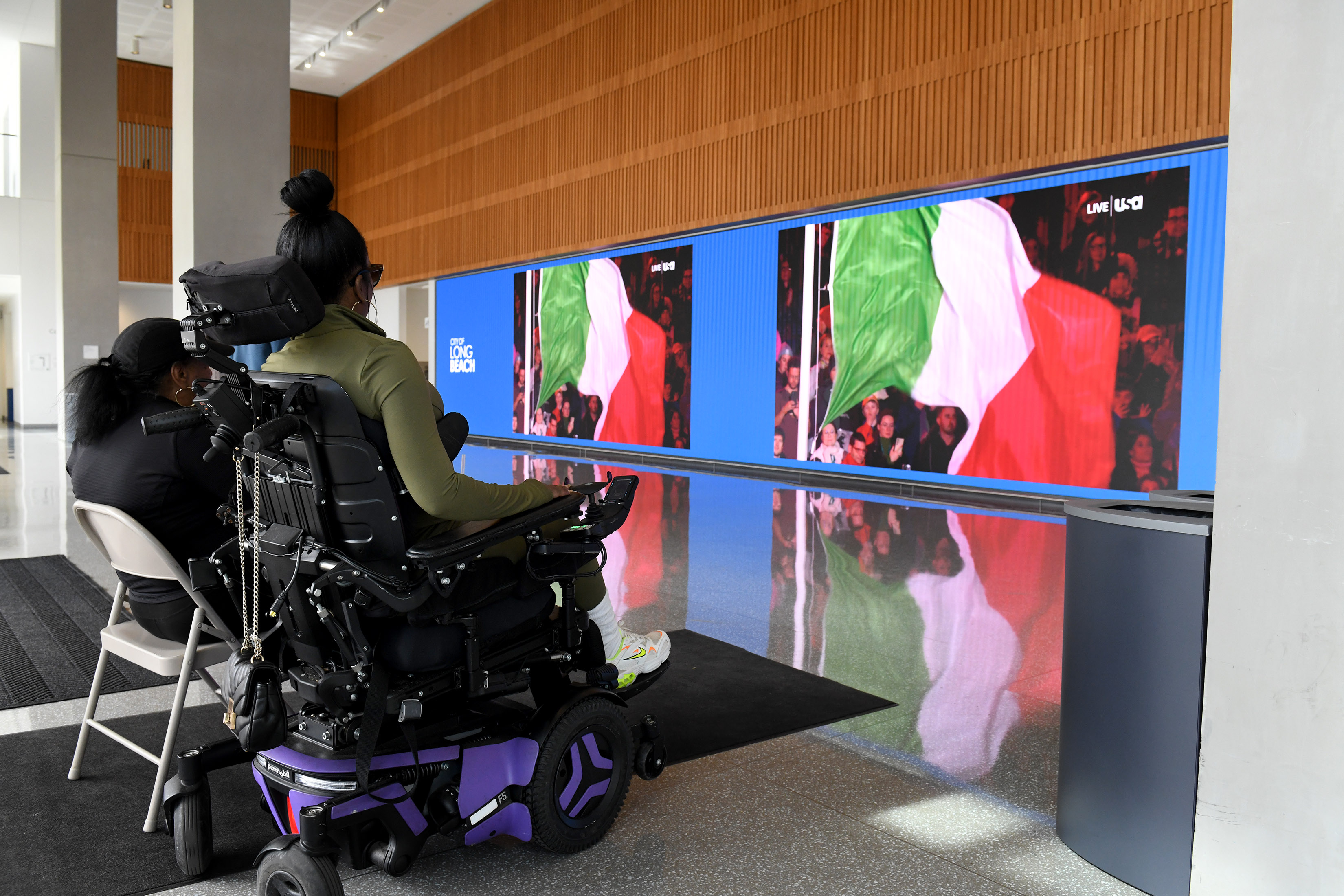 People watch the opening ceremony of the 2026 Winter Paralympic...