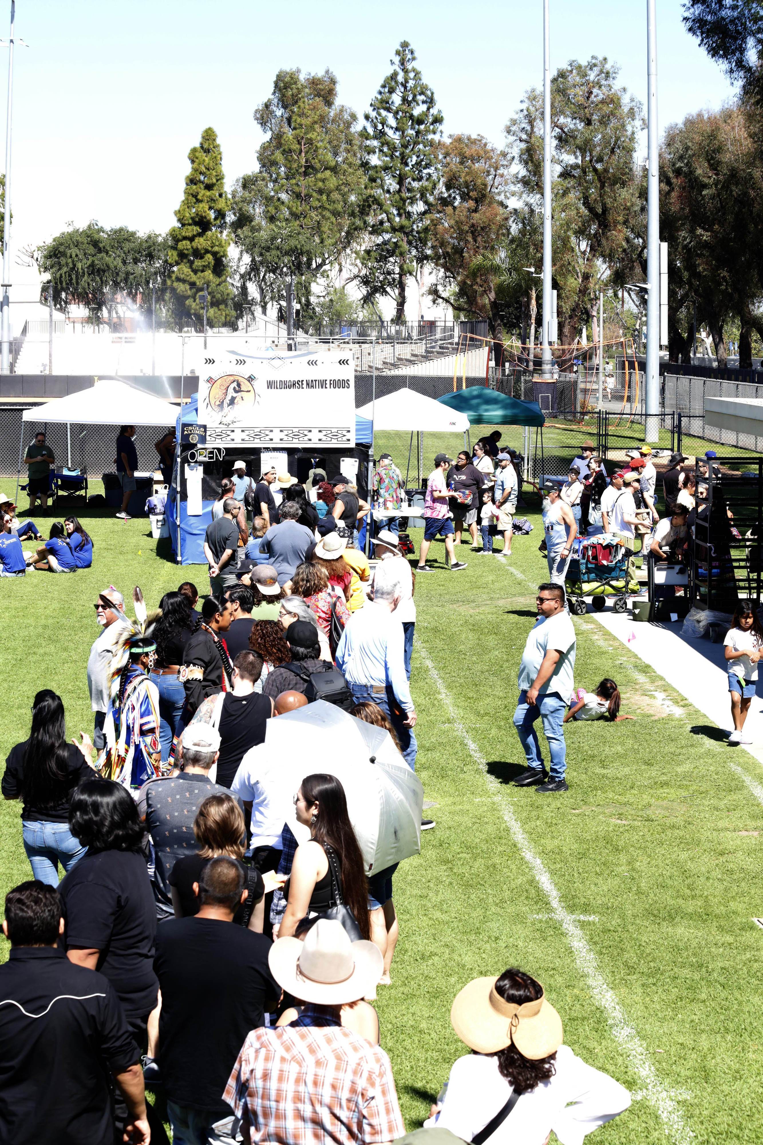 The crowds wait for authentic food during the Puvungna Pow...