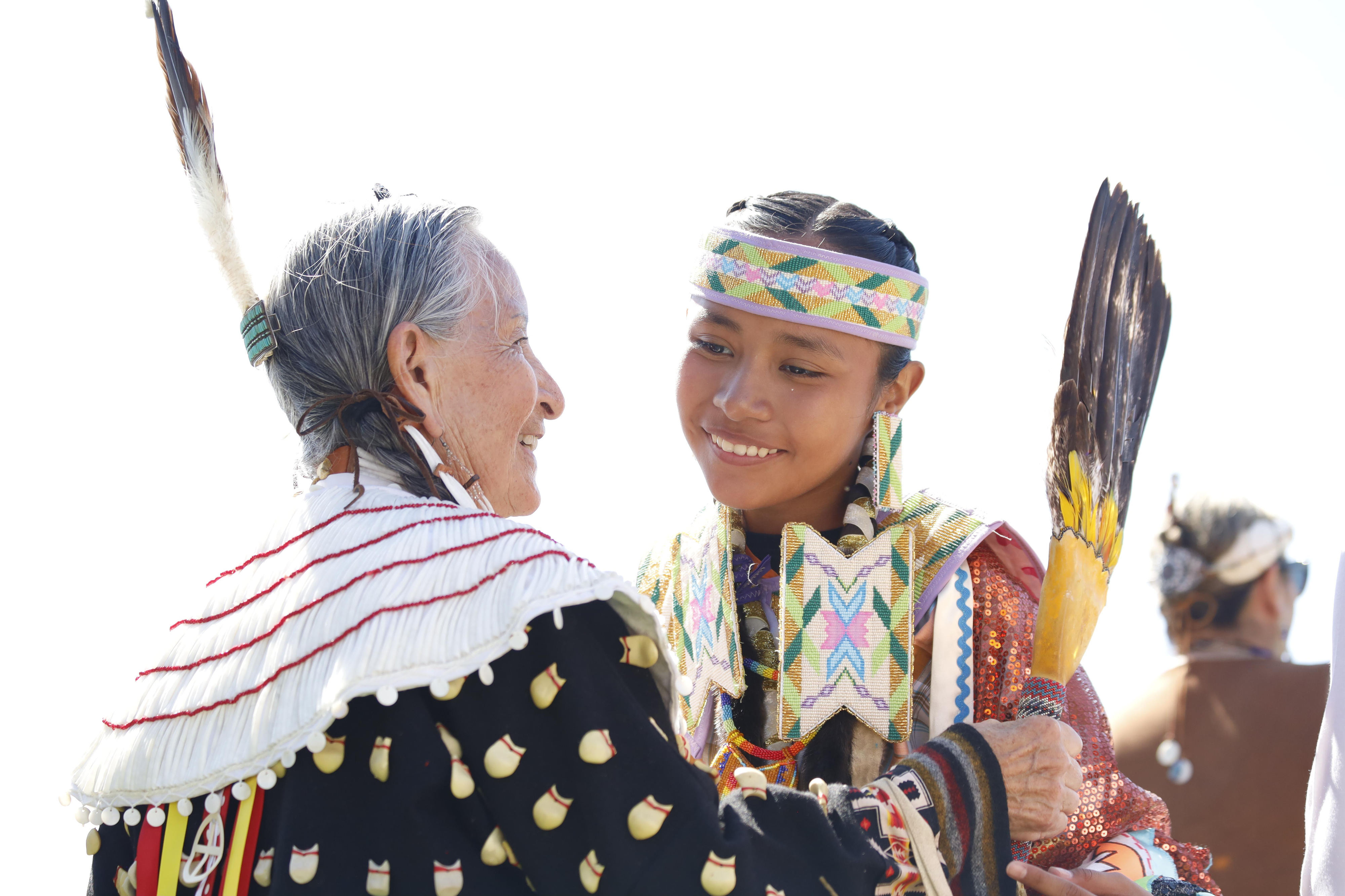 Intertribal dancers, young and old, get together for the Grand...