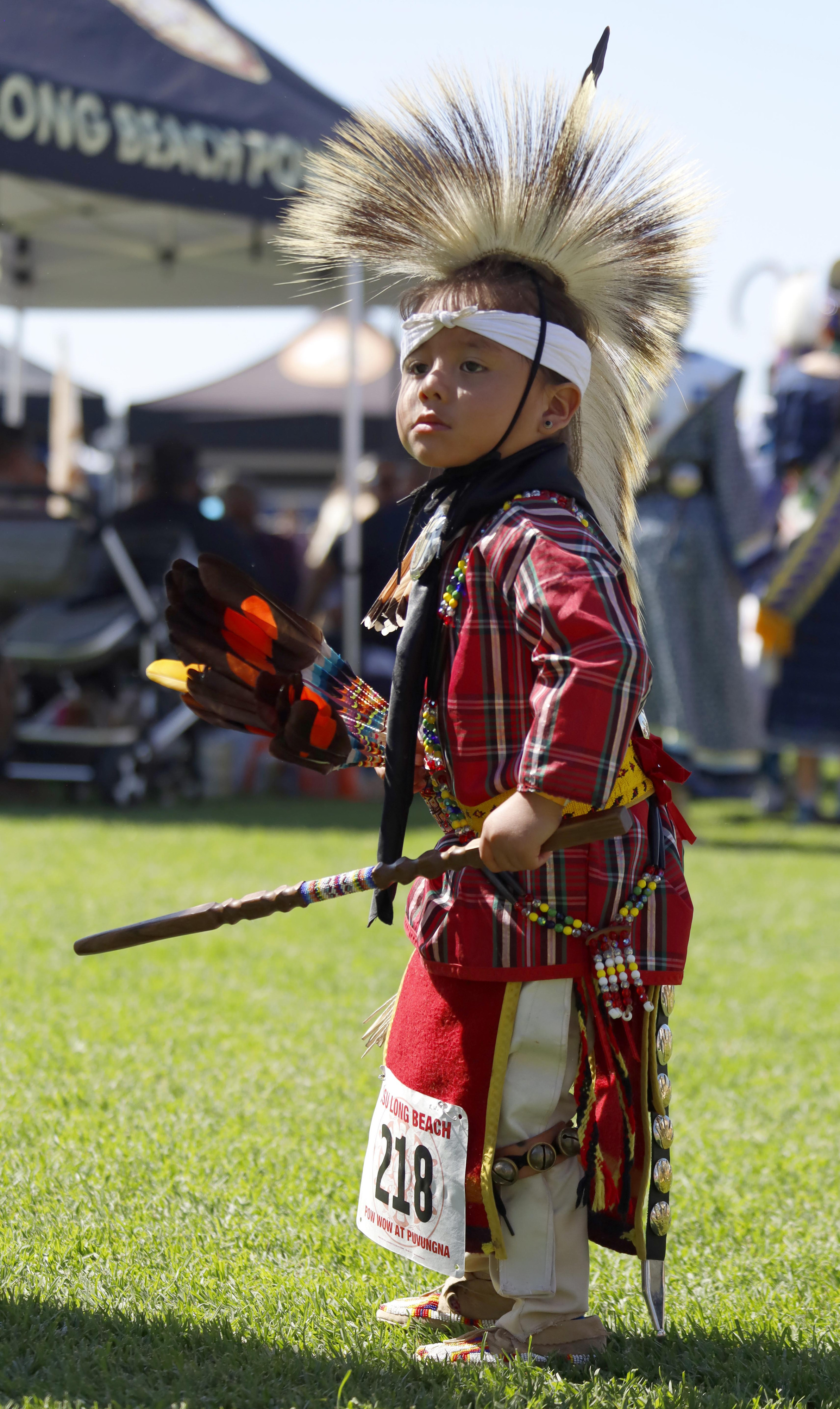 A very young dancer participates in the intertribal Grand Entry...