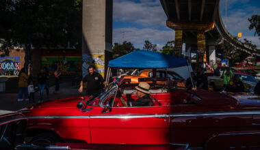 Marcos Arellano in his Impala convertible at Chicano Park in Barrio Logan on Oct. 16, 2022.