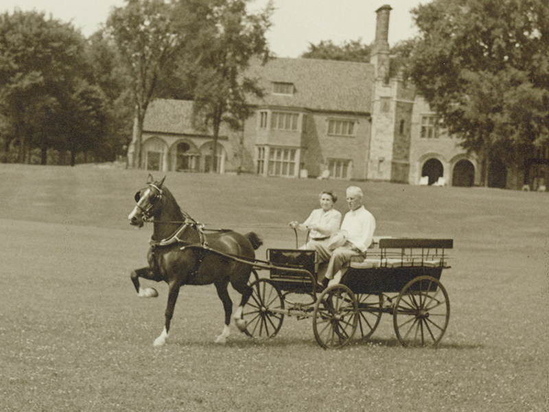 Matilda and her husband Alfred Wilson take a buggy ride on the grounds, circa 1955.