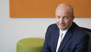 Matt Hanson against a colorful background