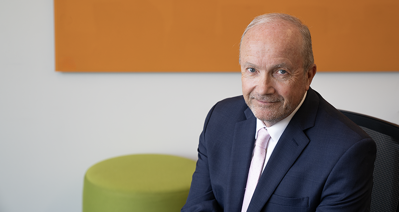 Matt Hanson against a colorful background