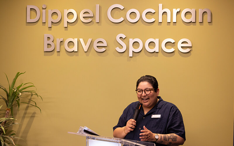 Nat Betancourt Arellano, senior coordinator of the LGBTQ Resource Center, speaks at Brave Space event
