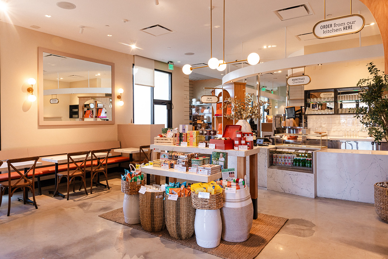 A chic modern peach-colored casual restaurant in LA suburban Westlake Village called Neighborly with boutique ingredients and some seating.