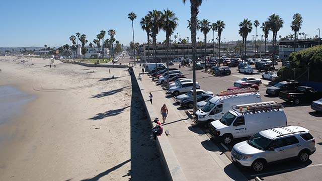 Beach parking lots open in line with city restrictions loosening. Ocean Beach Pier parking was nearly filled early in the morning.