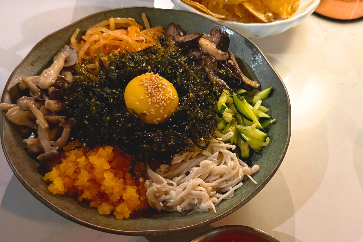 Mushroom bibimbap, mixed rice/vegetables plate with shitake mushrooms, enoki, egg...