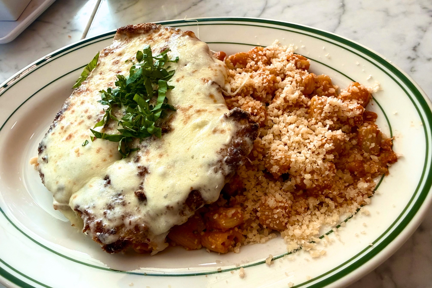A chicken parmesan plate from Pinwheel Pasta, located in Rancho...