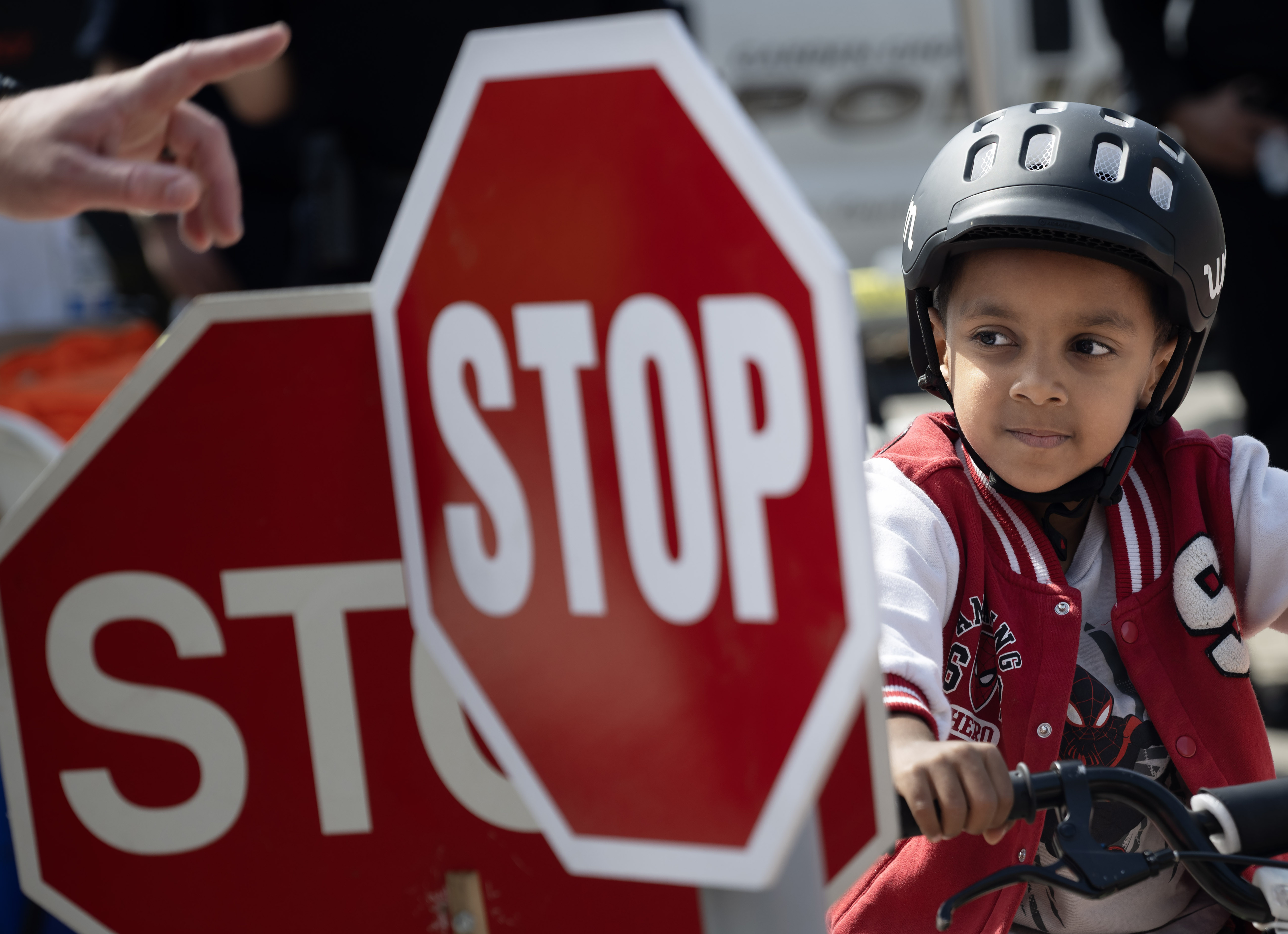 Garden Grove traffic officers teach young cyclists, like Kaleb Araya,...