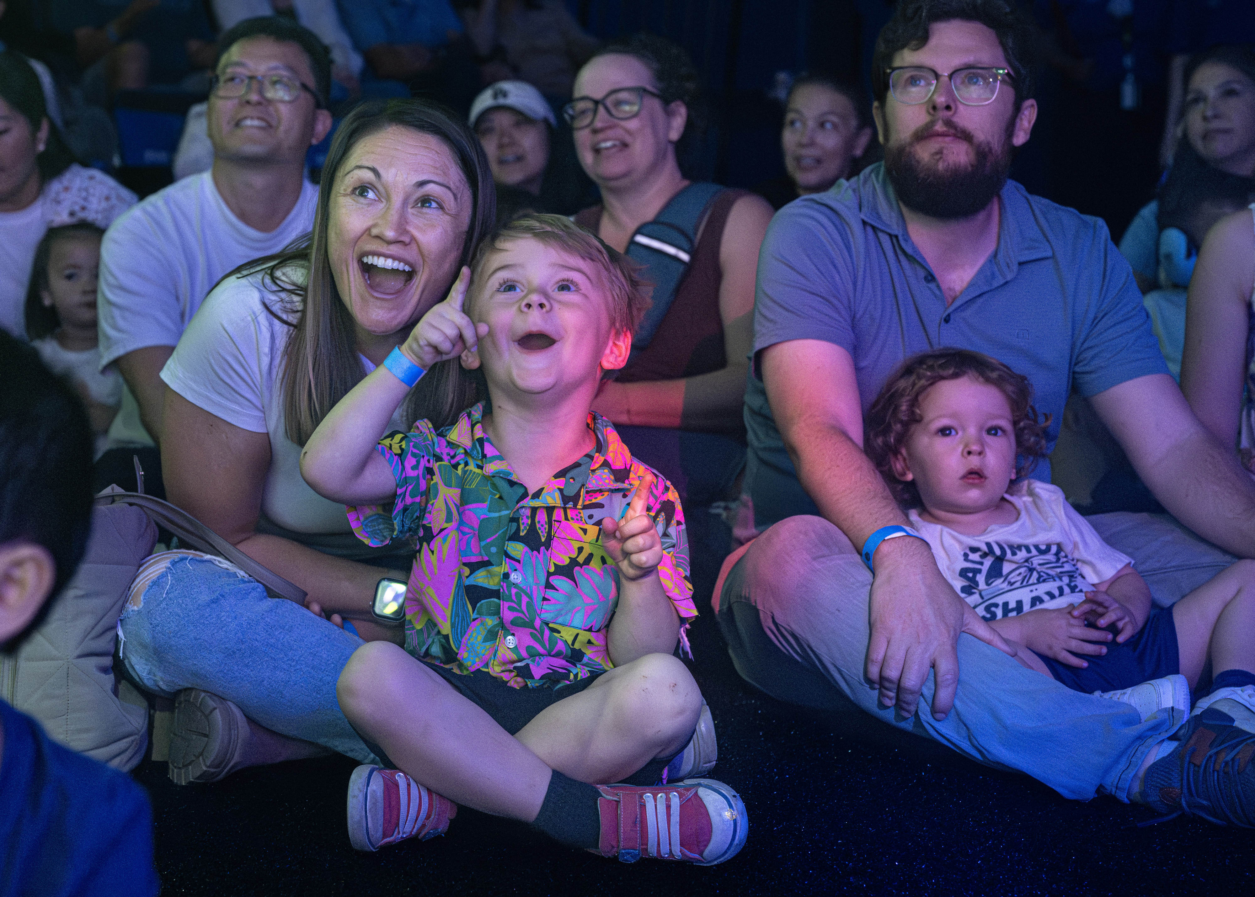 Caitlin Bedsworth and her 3-year-old son, Thorton, watch bubble artist...