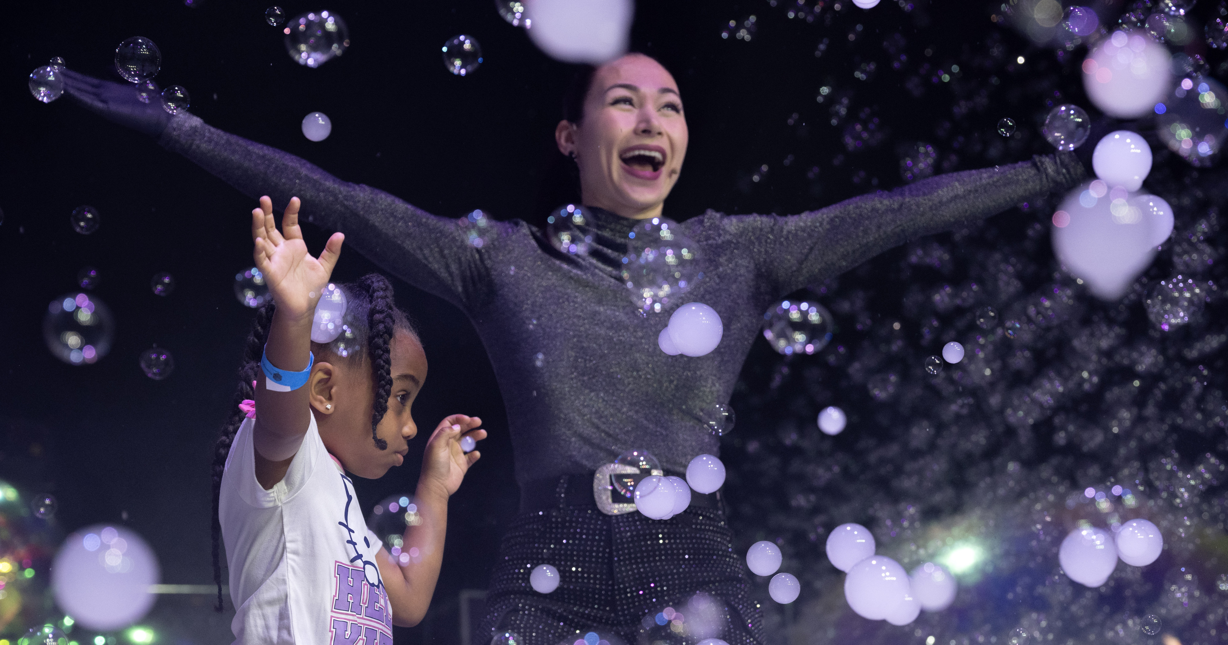 Kenzie Lewis, 4, is introduced to a storm of bubbles...