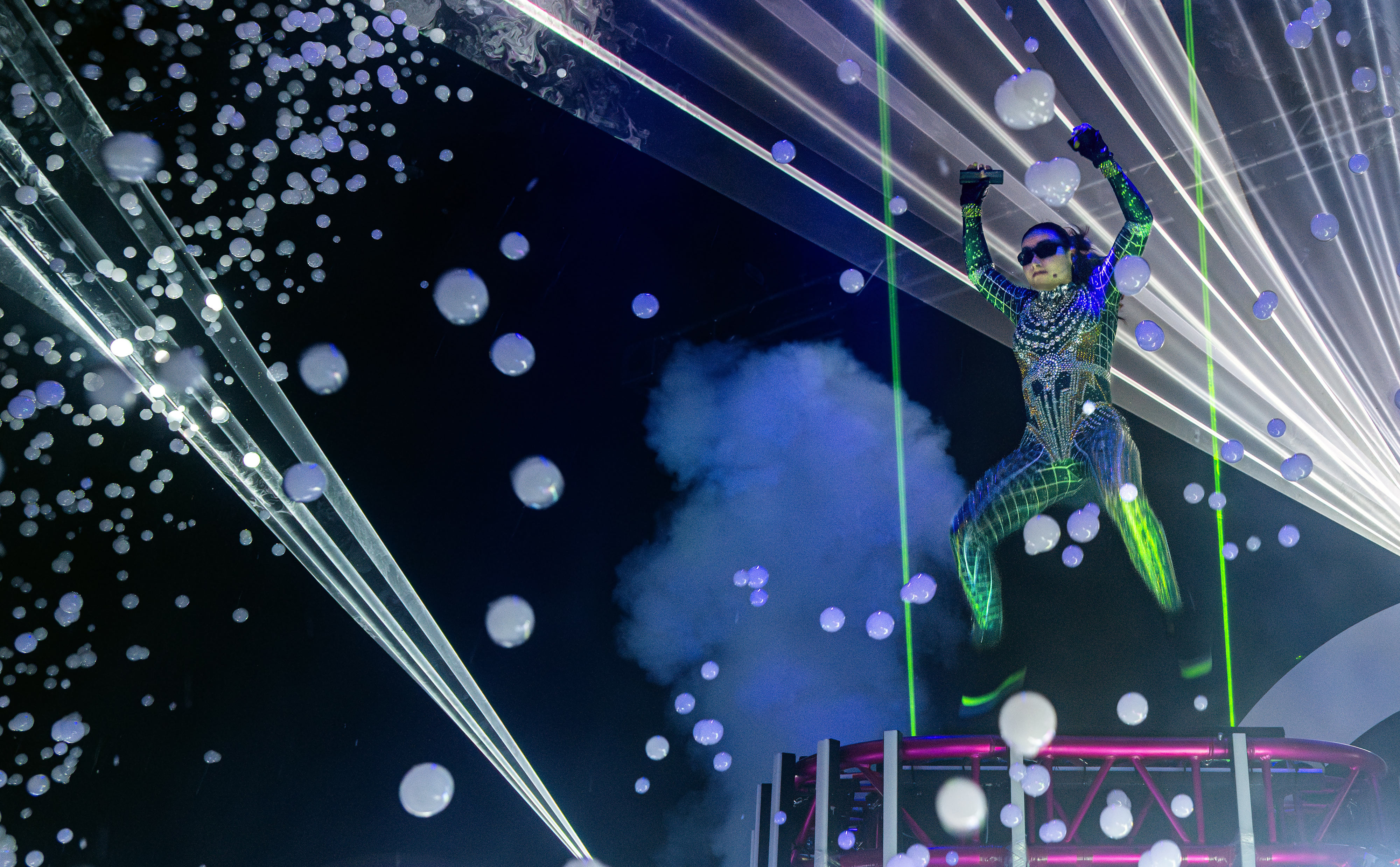 Melody Yang uses lasers and bubbles during a Bubblefest performance...