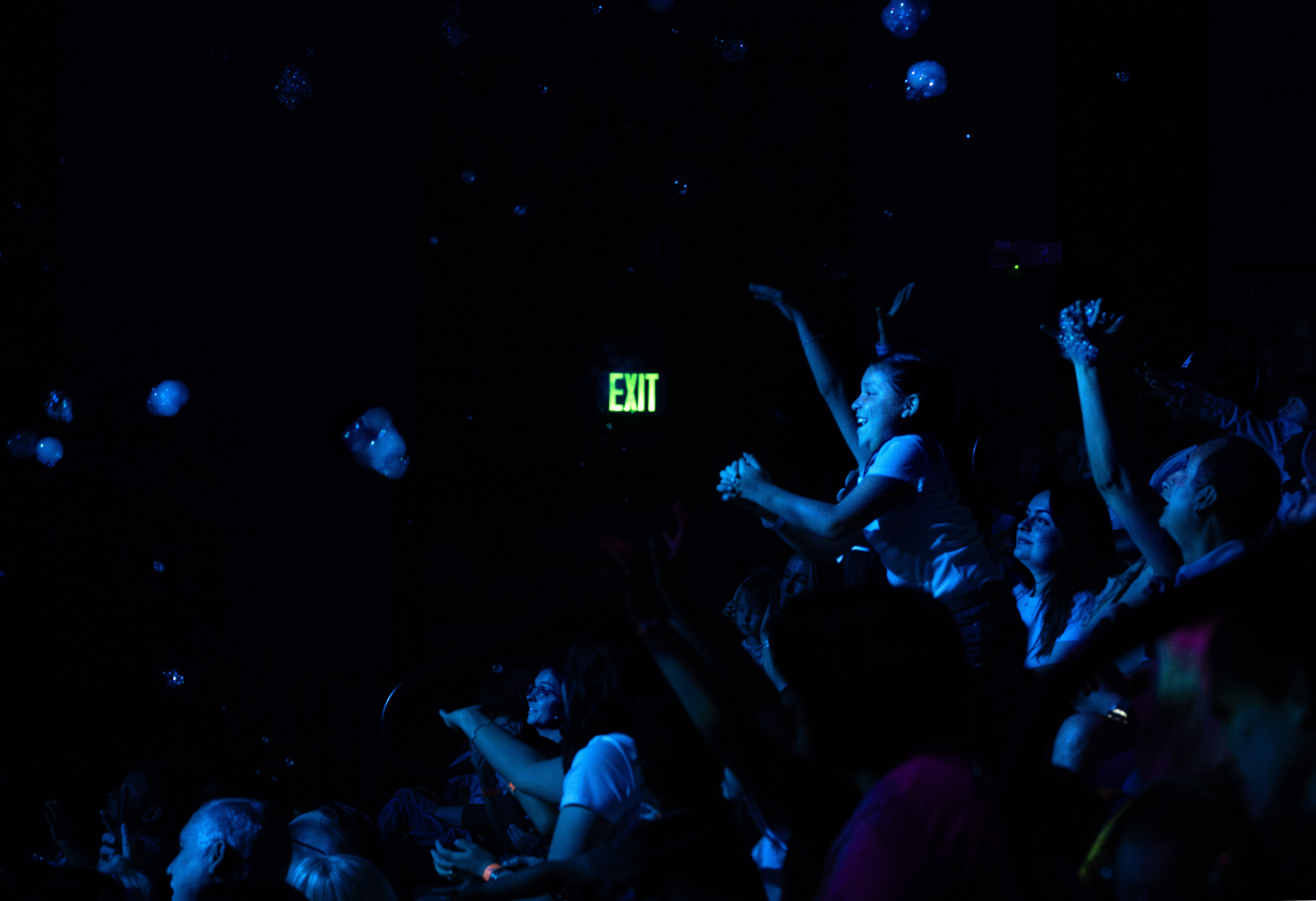 Bubbles are released into the audience at the end of...