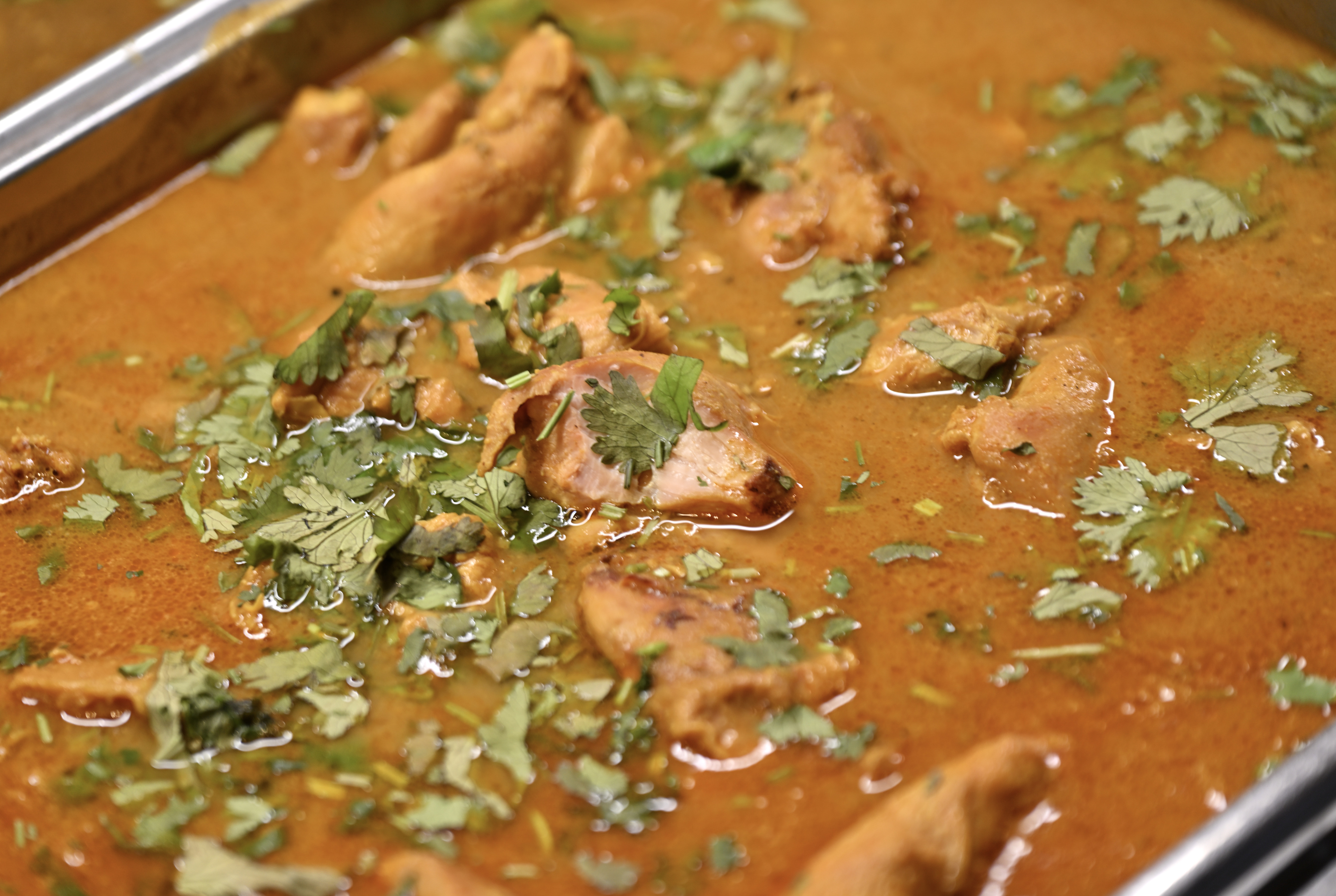 The lunchtime buffet at Royal India Restaurant includes chicken curry...