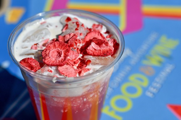 Strawberry Guava Lemonade; Simply Lemonade, strawberry purée and guava syrup topped with vanilla cream and freeze-dried strawberries at the Peppers Cali-Ente festival marketplace food booth during the California Food & Wine Festival inside California Adventure running March 6 through April 27, 2026. Photographed on Friday, March 6, 2026. (Photo by Jeff Gritchen, Orange County Register/SCNG)