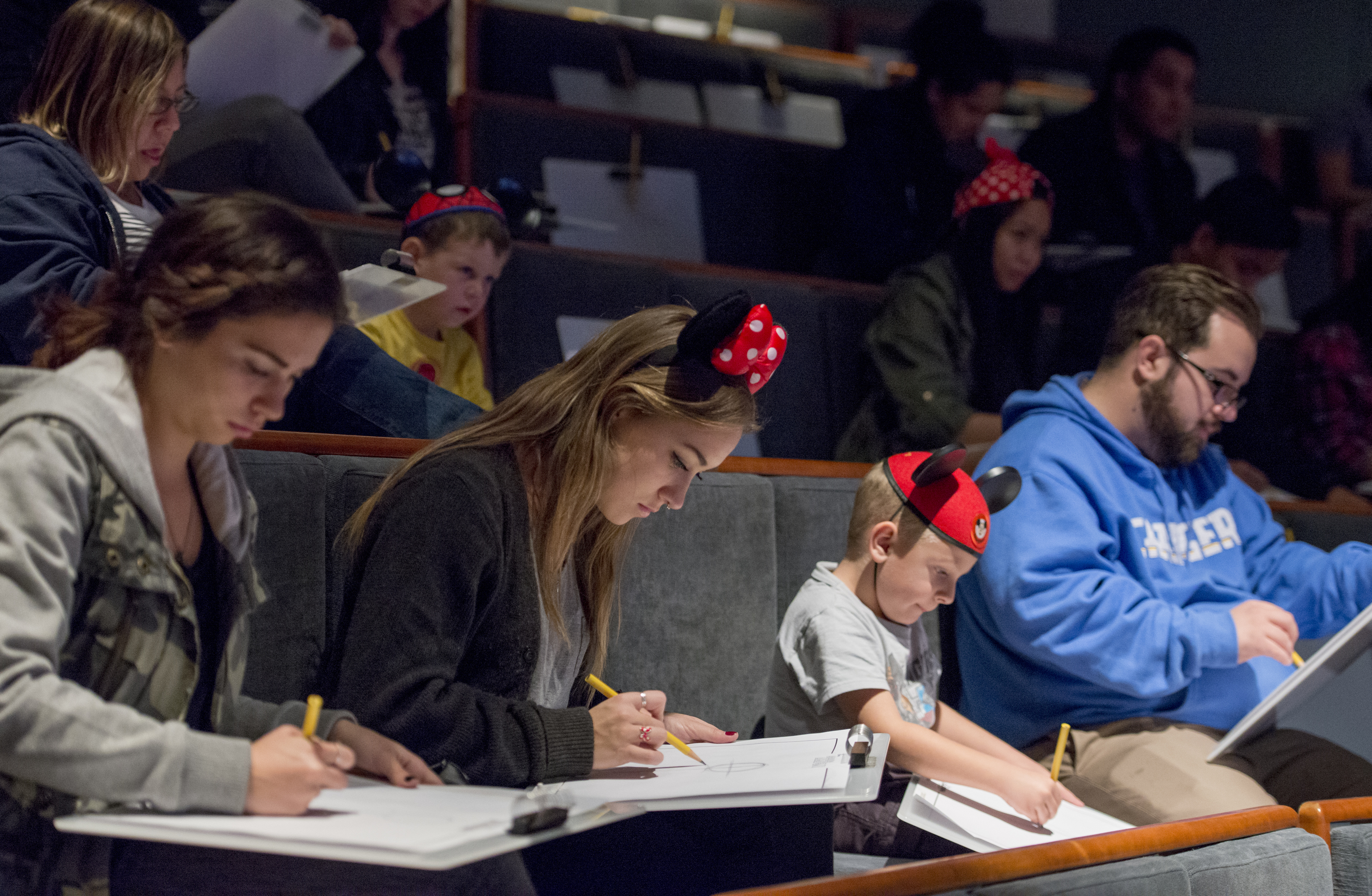Guests at Disney California Adventure’s Animation Academy learn to draw...