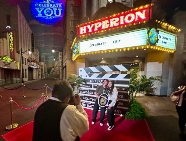 Honorees pose for photos in front of the Hyperion Theater during the Celebrate You service celebration at Disney California Adventure. (Photo by Brady MacDonald, Orange County Register/SCNG)