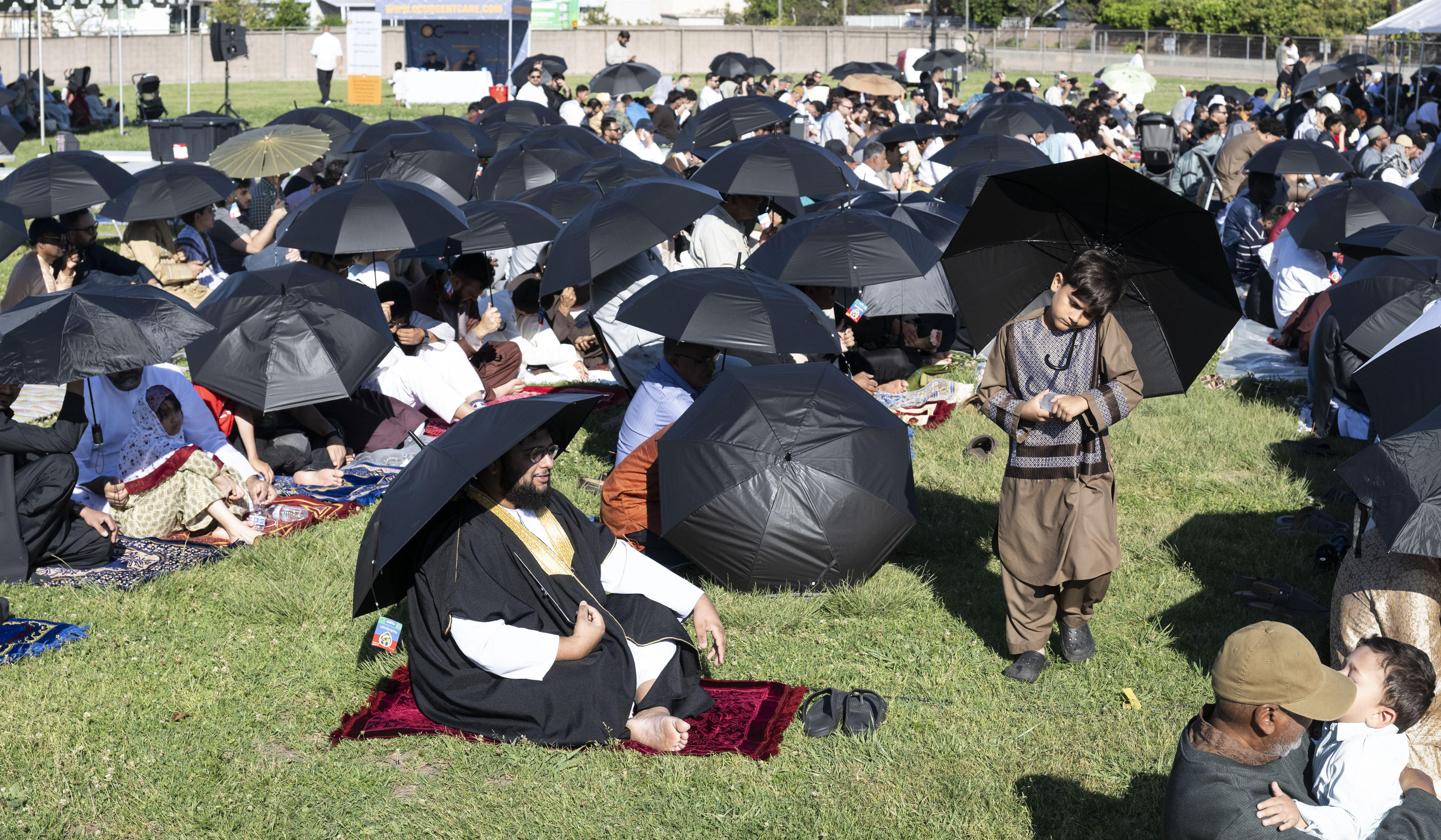 People try to stay cool during an Eid ul-Fitr celebration...