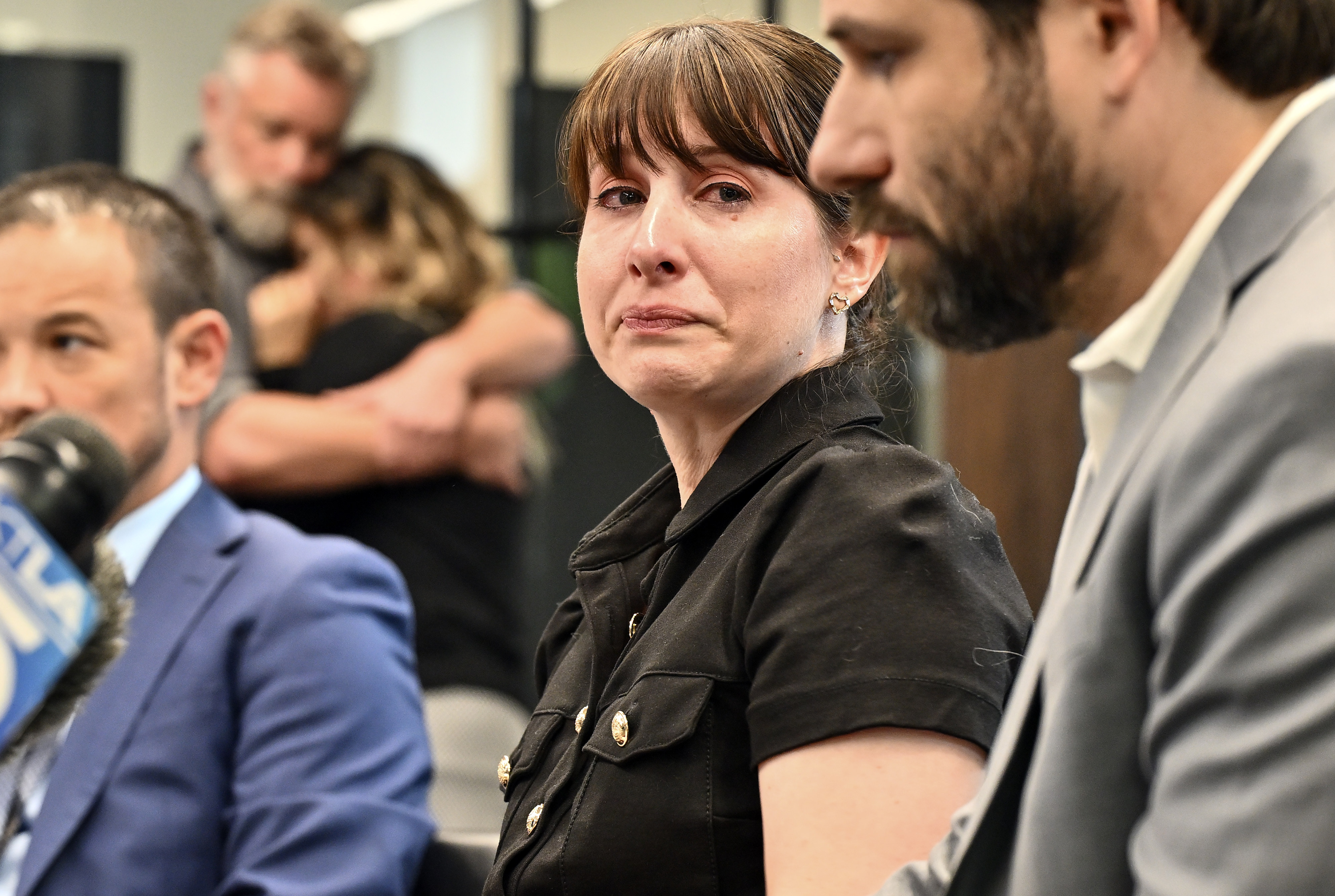 Christina Chandler looks to Ryan Webster as they speak to...