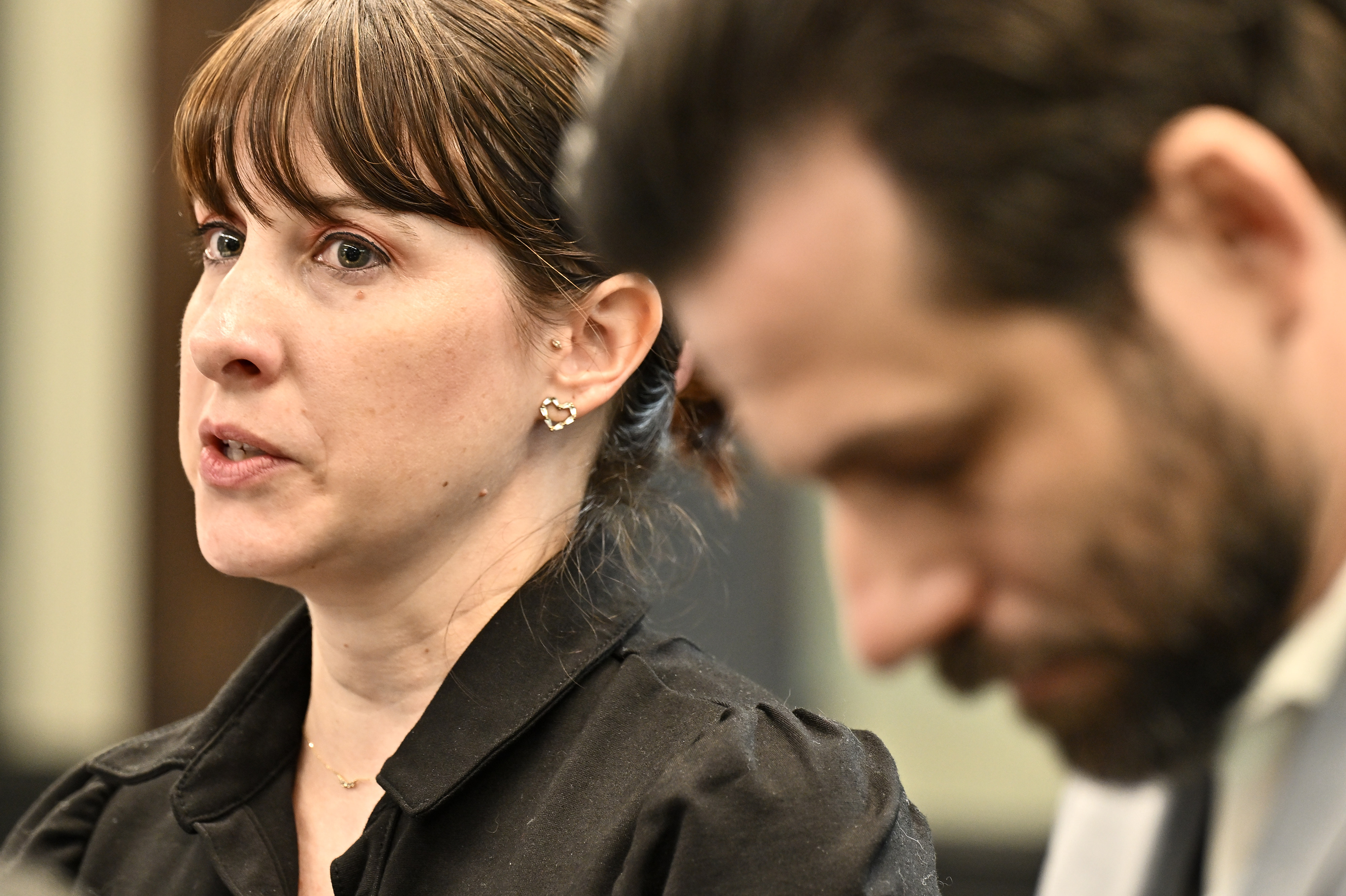 Christina Chandler looks to Ryan Webster as they speak to...