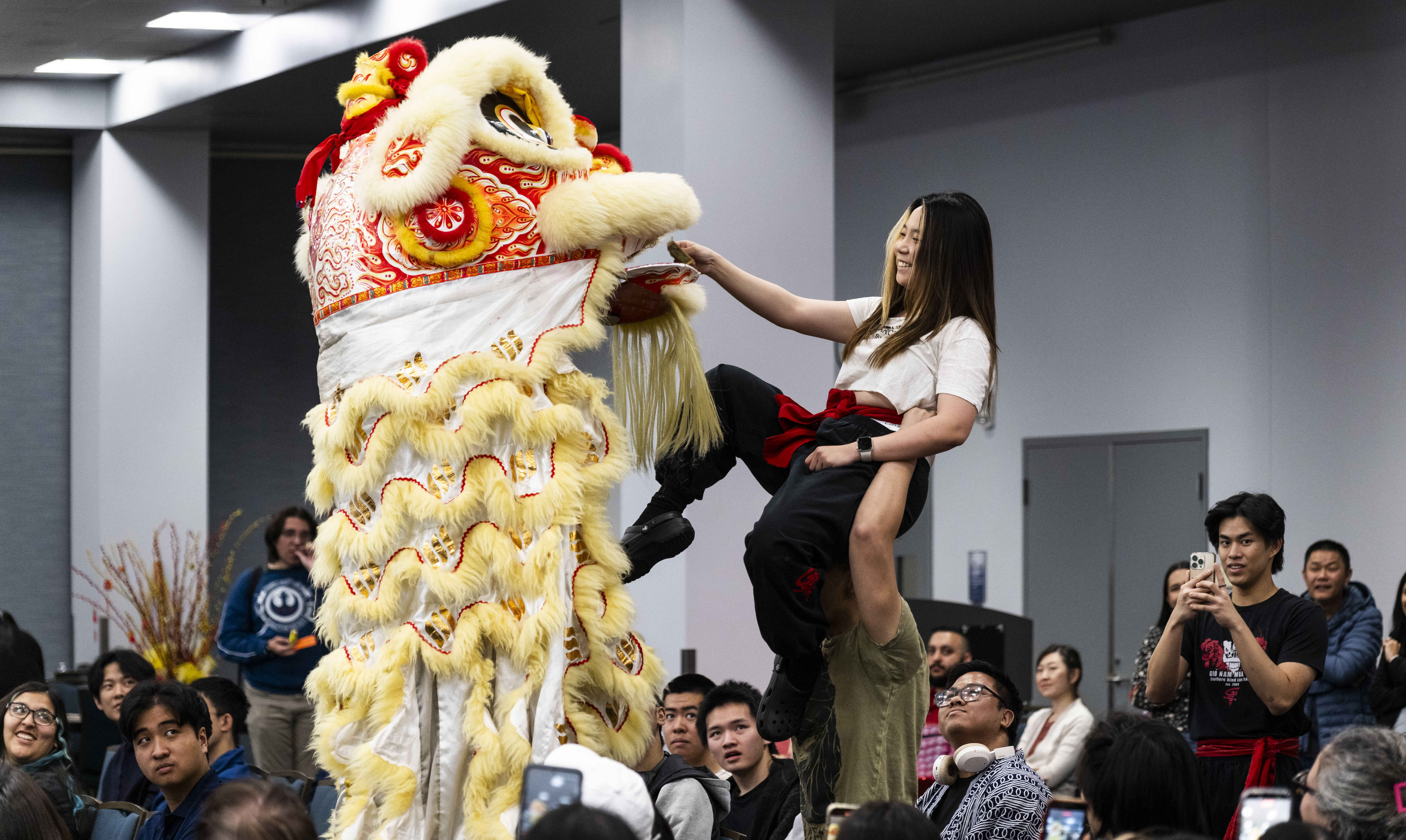 An offering is given during a performance by Southern Wind...