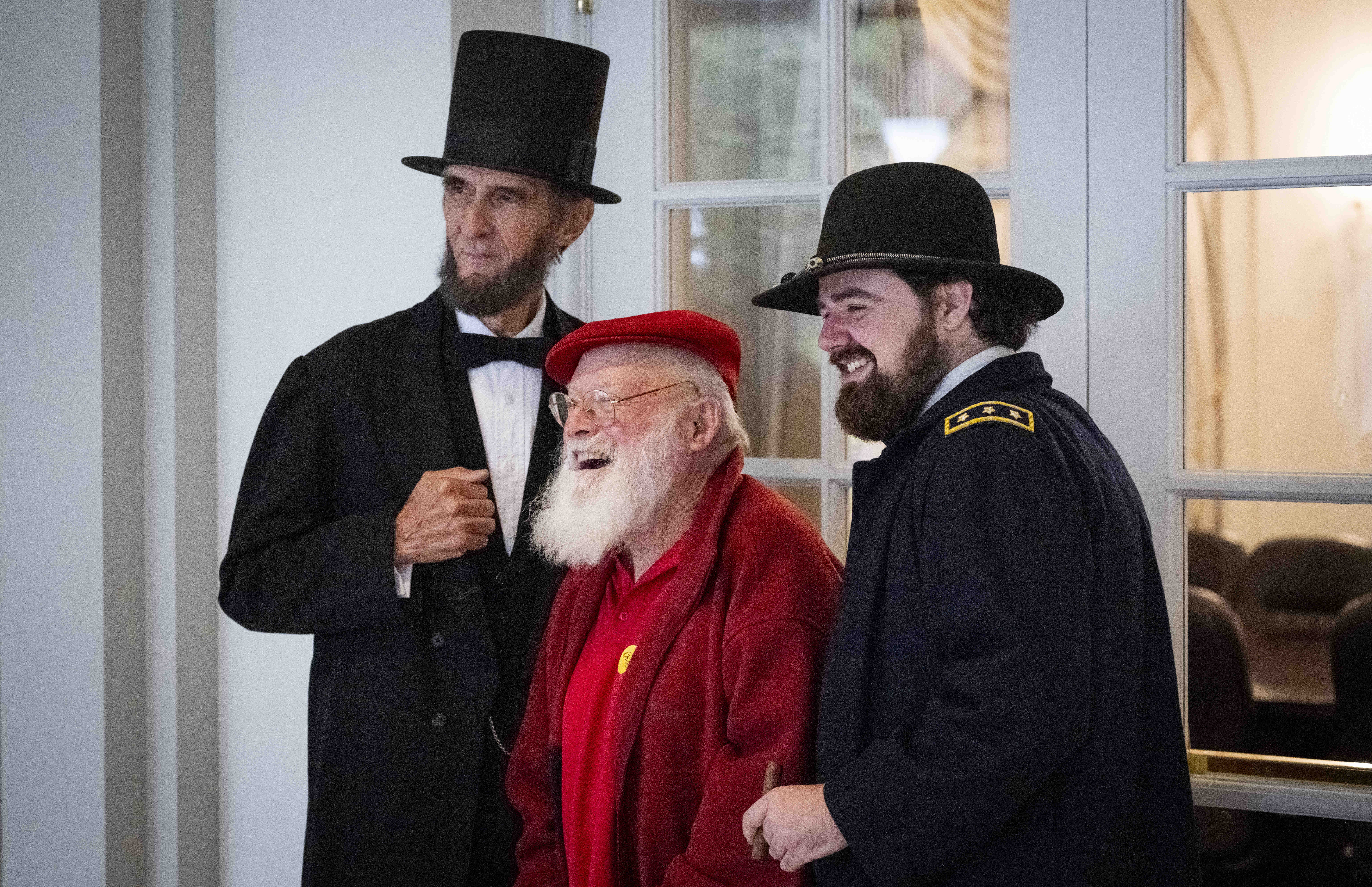 Jim Ponnet, 74, takes a photo with Abraham Lincoln and...
